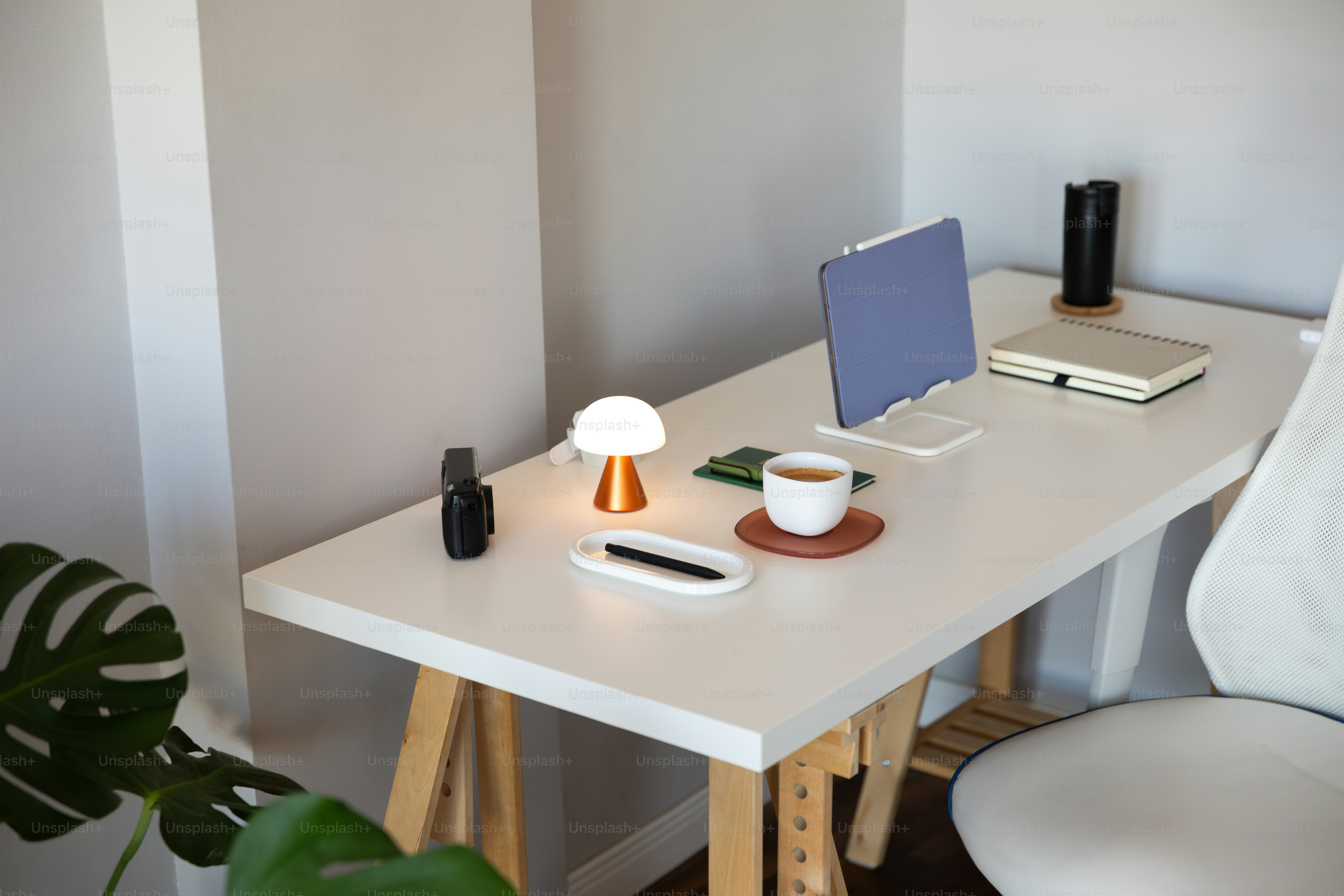 clean minimal workspace with smartphone, laptop, notebook, neutral tones, calm atmosphere
