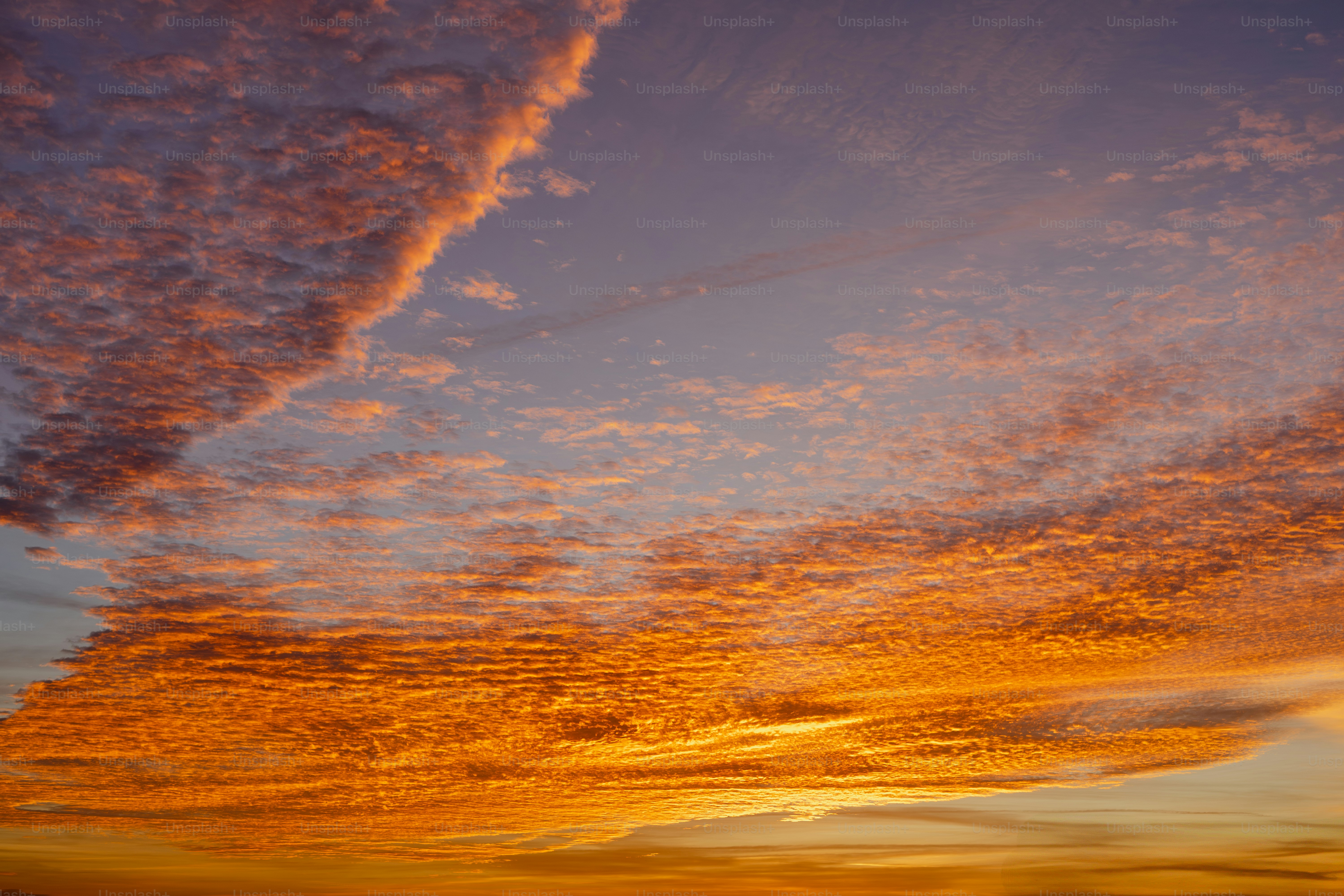 A sunset with clouds in the sky