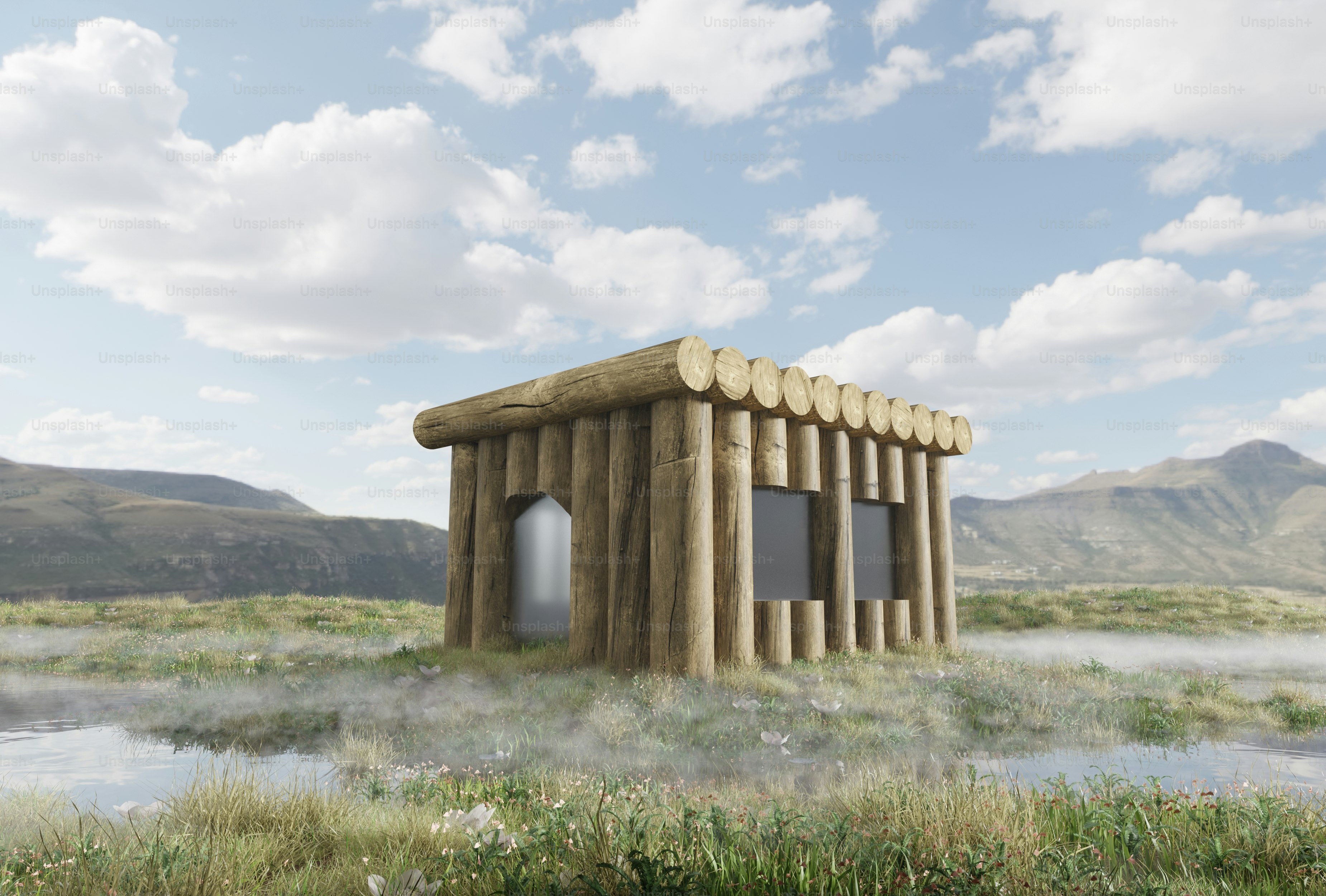 Un pequeño edificio en un campo con montañas al fondo