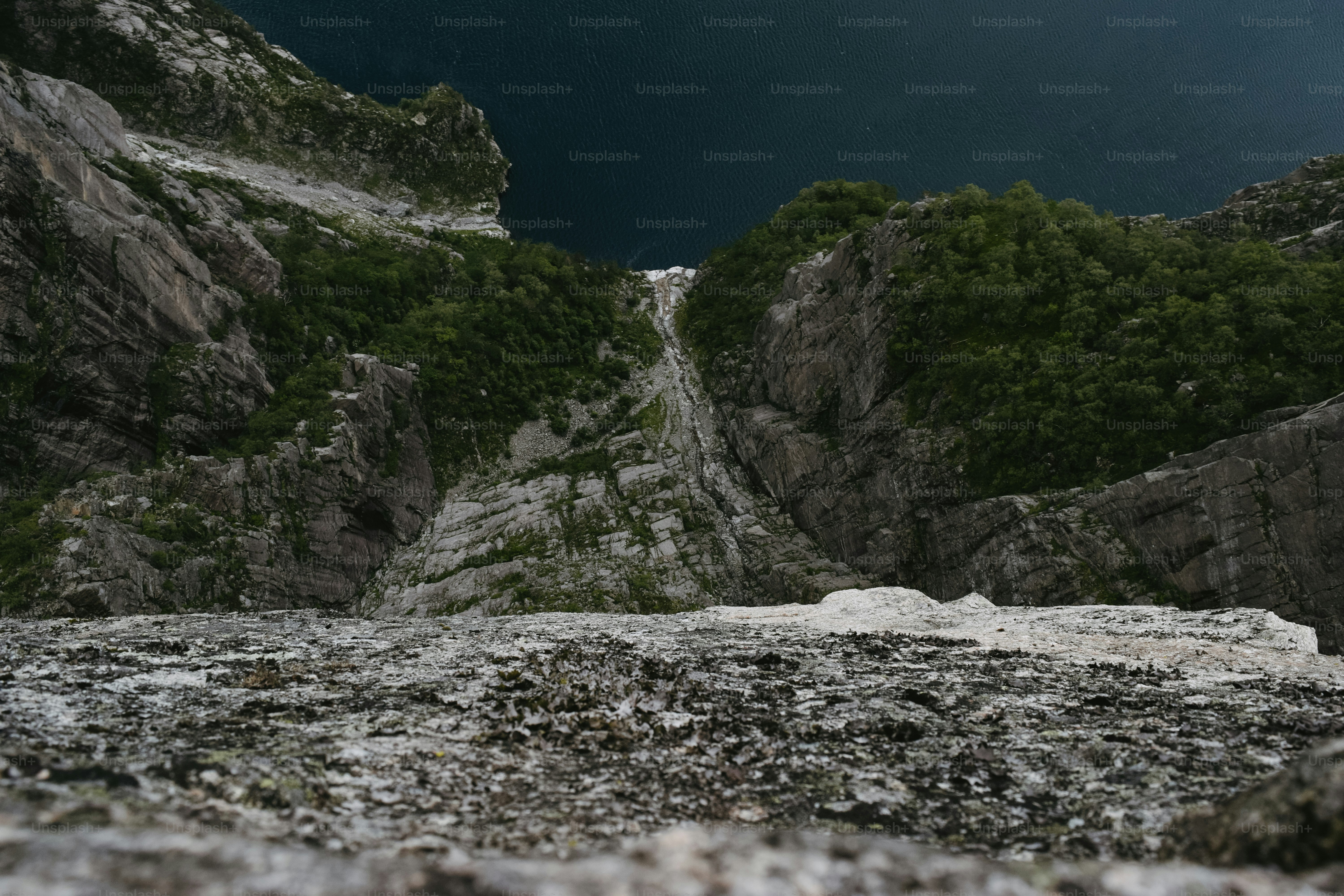 A dark sky with a mountain in the background