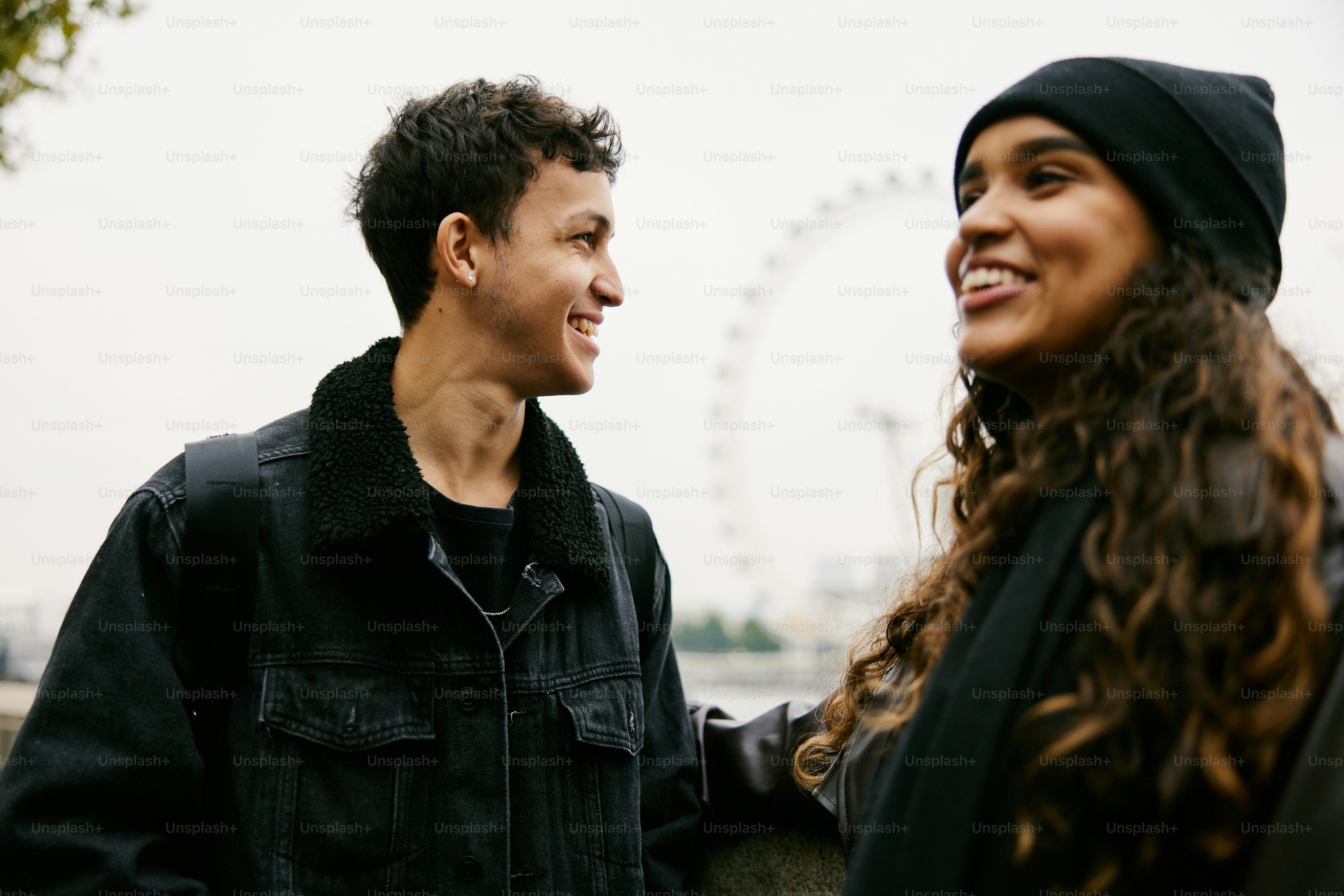 A man and a woman standing next to each other