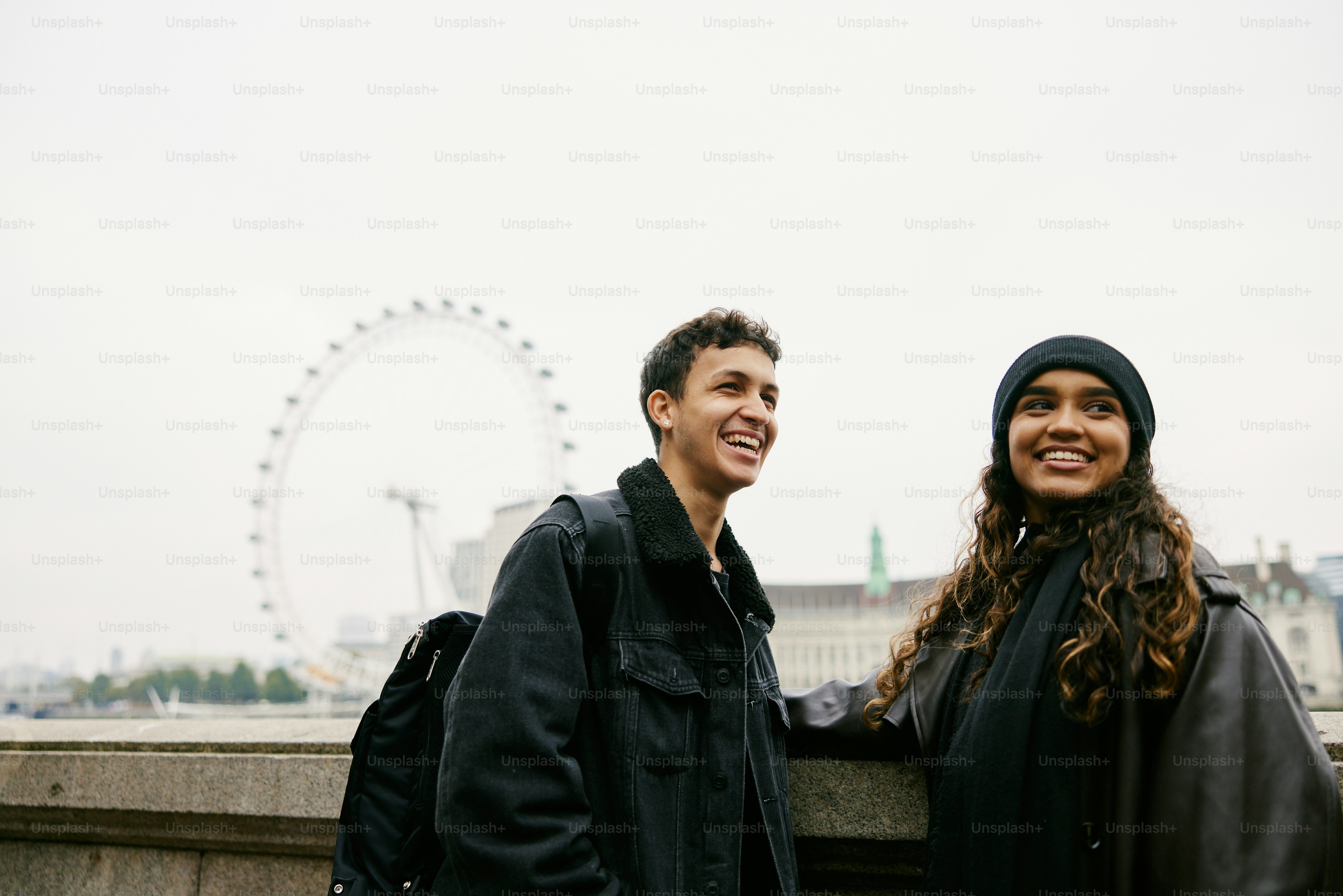 A man and a woman standing next to each other