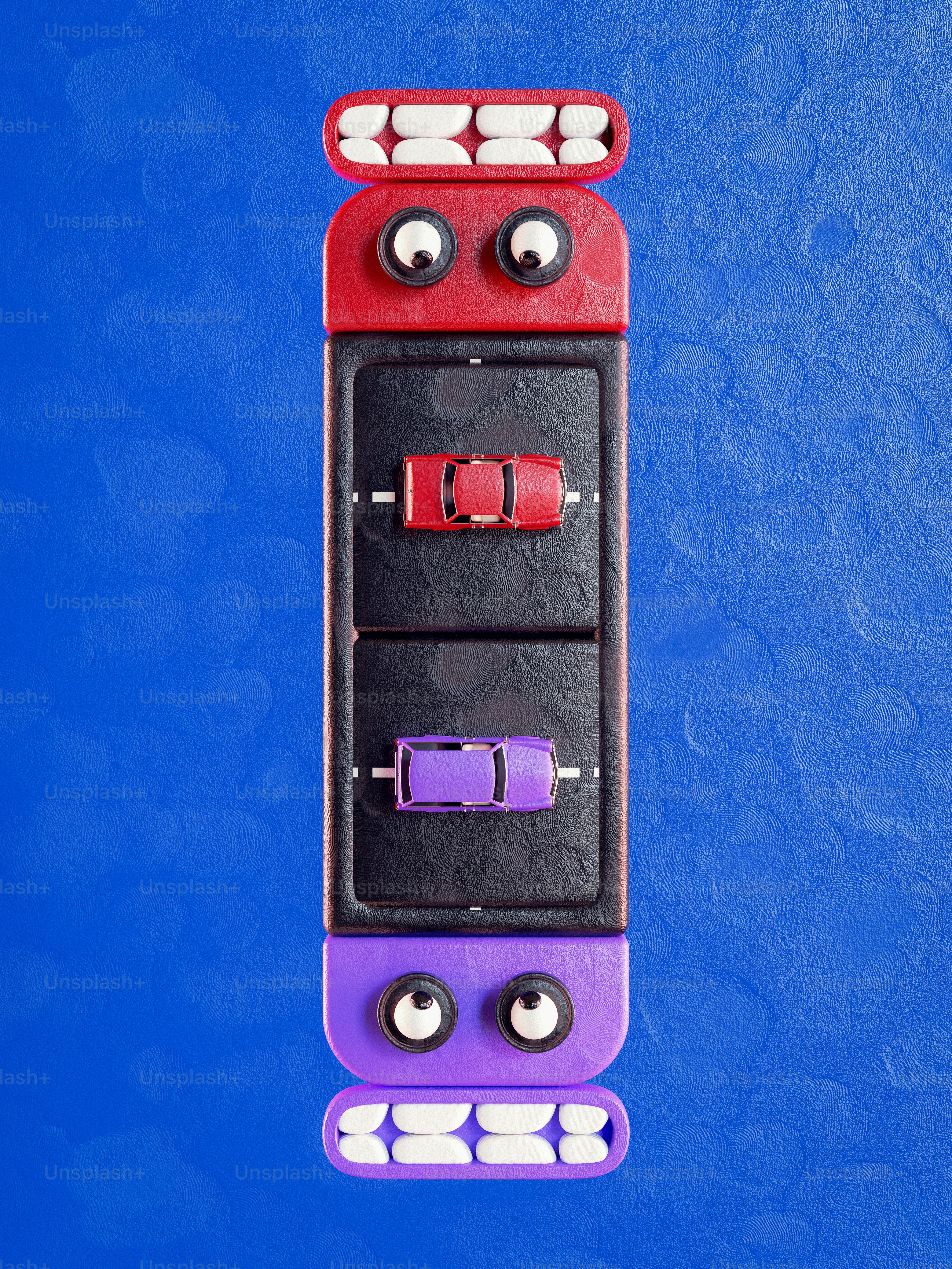 A purple and red toy car with eyes on it