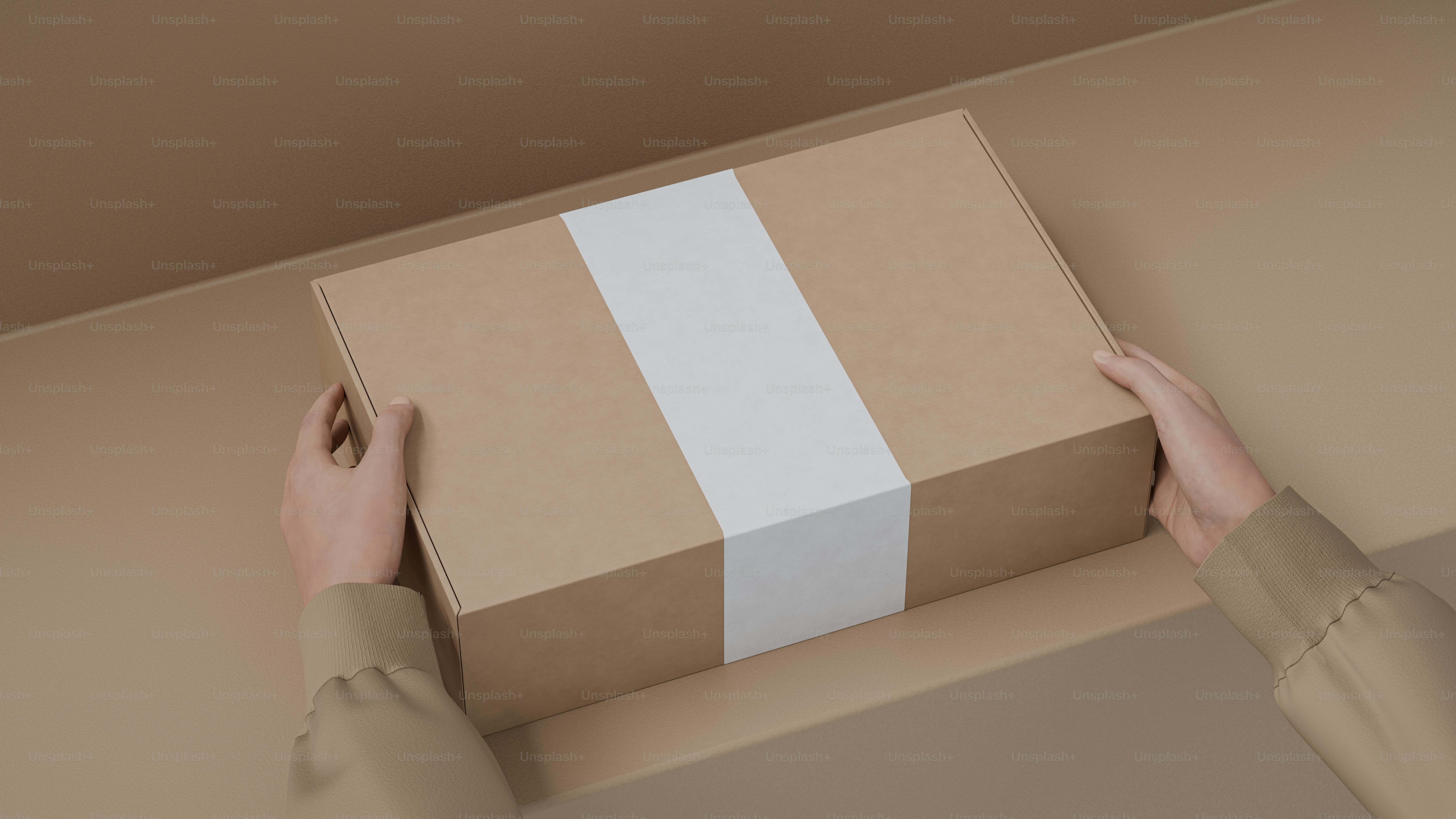 A person holding a brown box with a white stripe