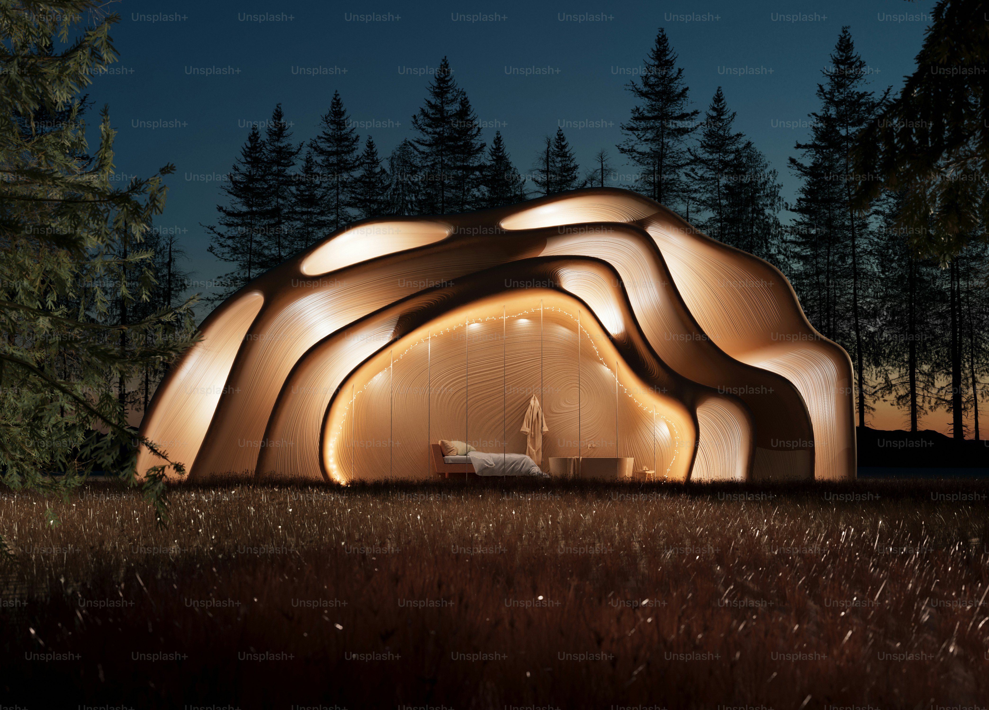 A lit up tent sitting in the middle of a forest