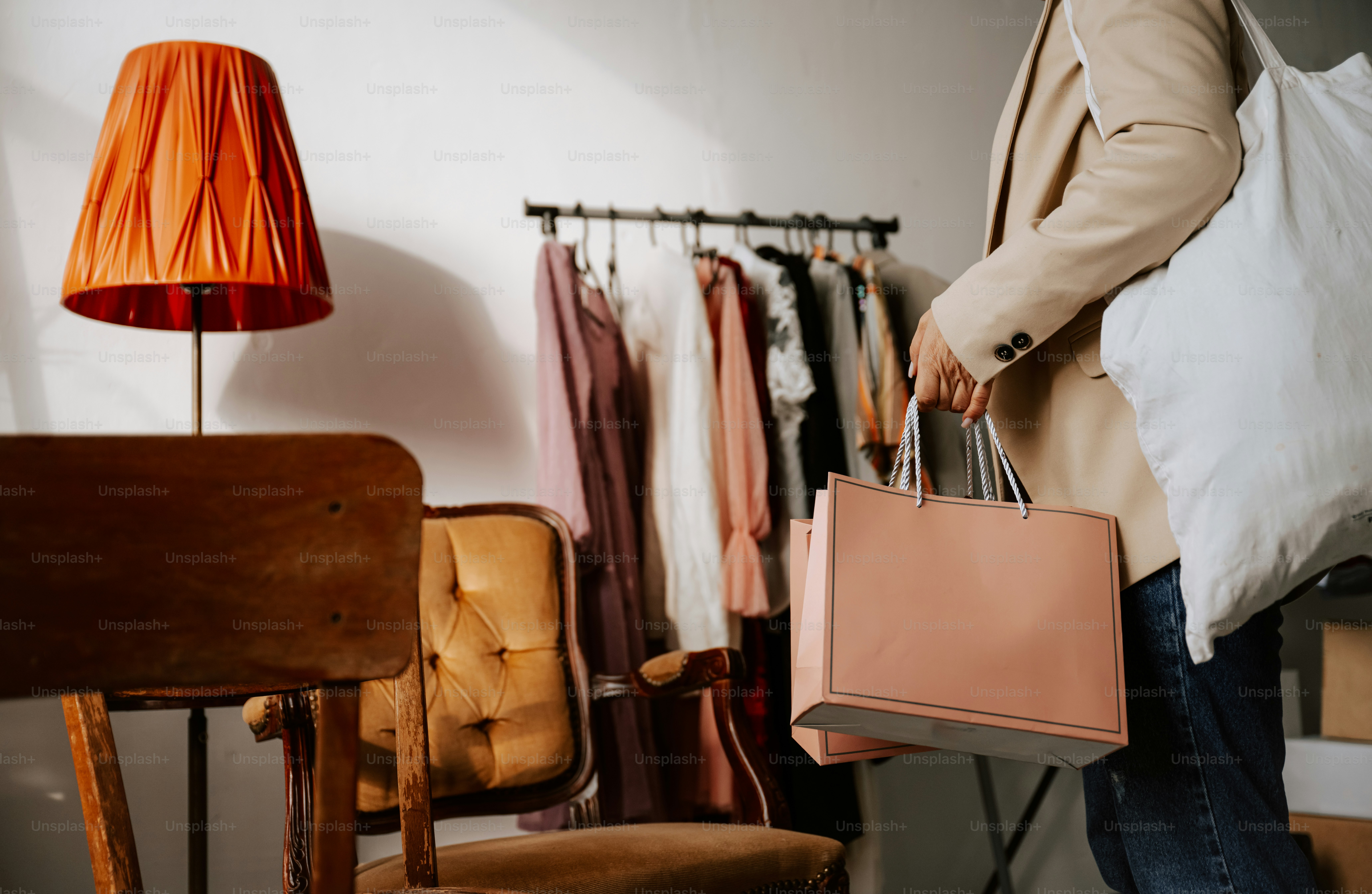 A man carrying a bag in a clothing store