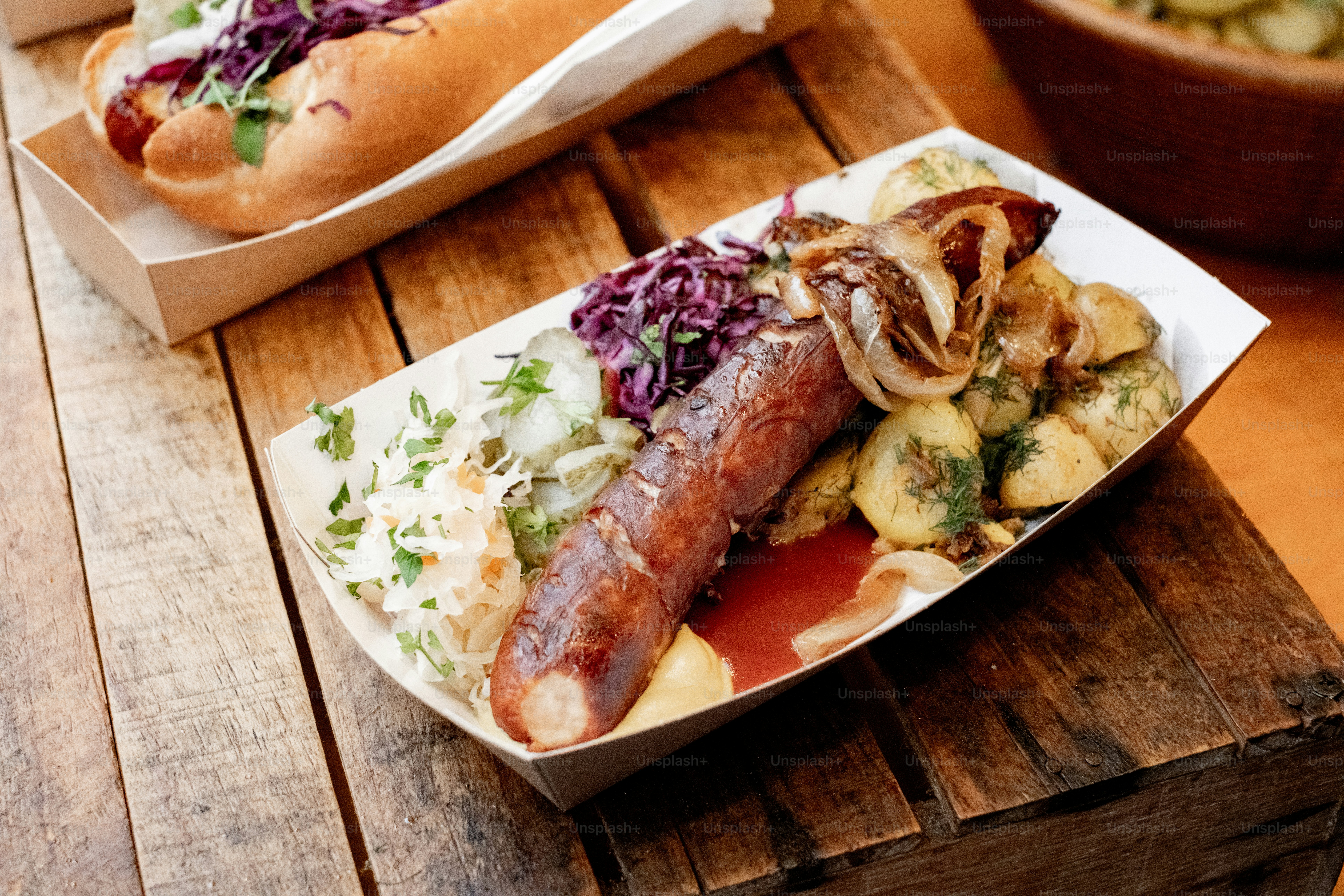 Two plates of food on a wooden table