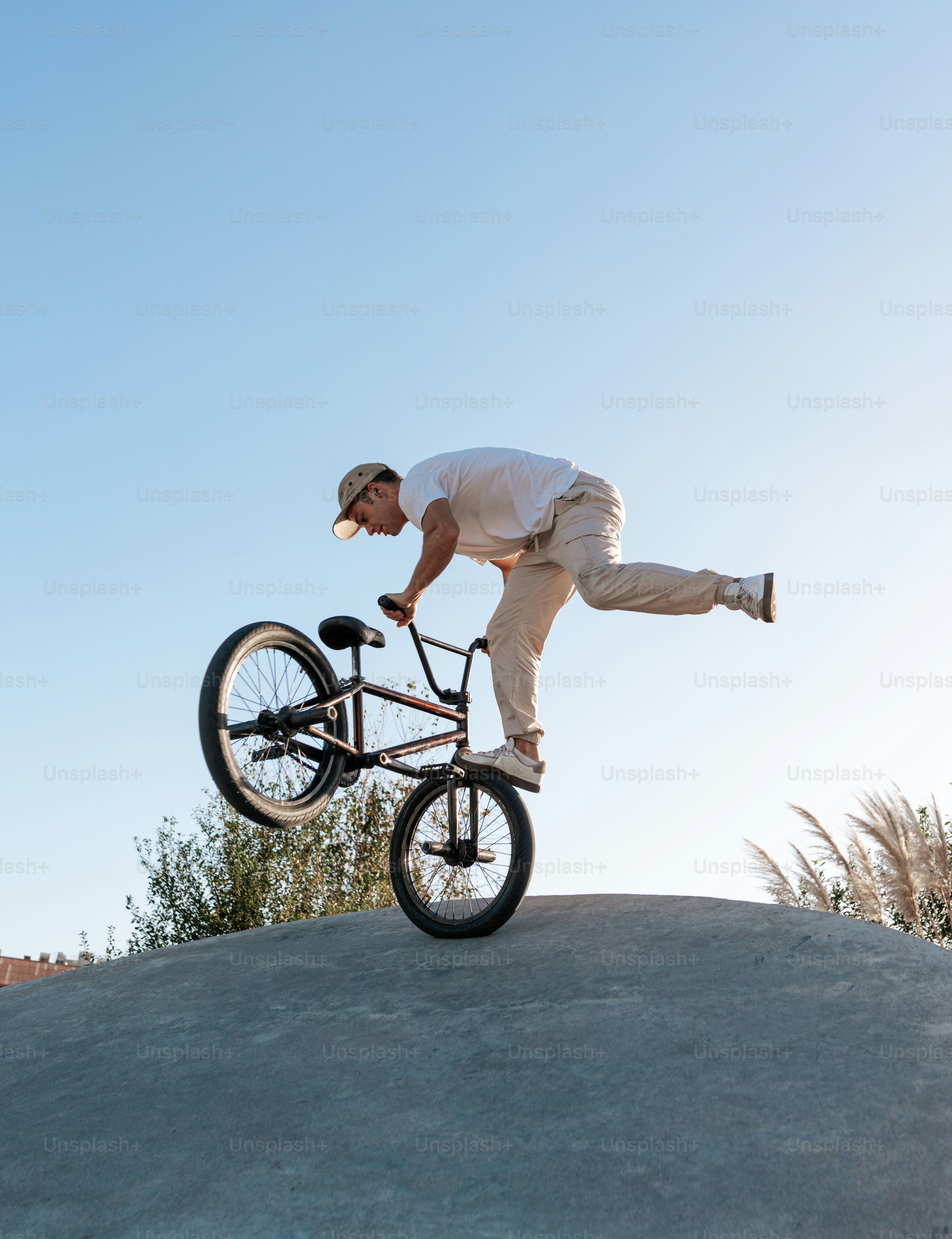 A man riding a bike on top of a ramp