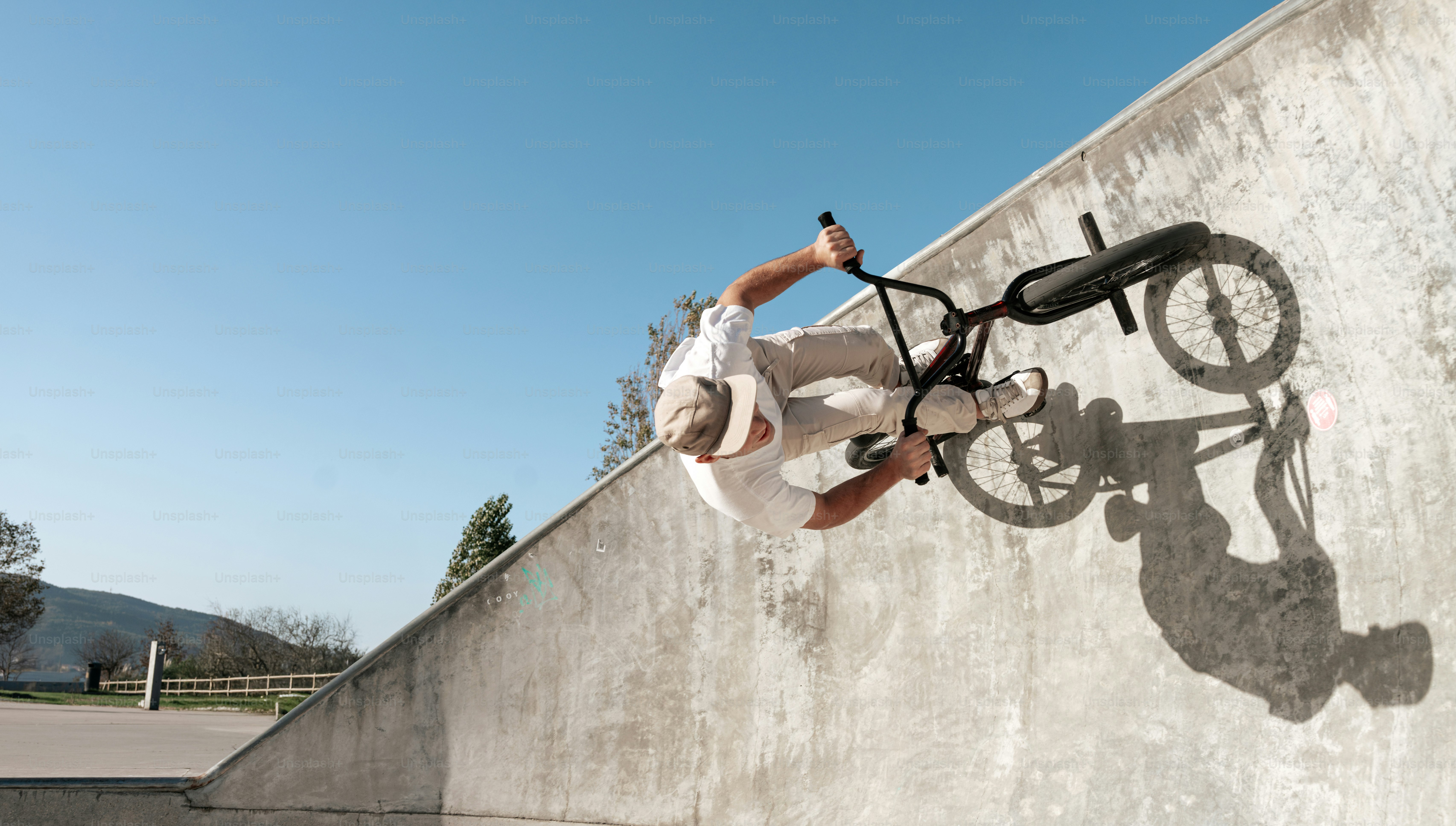 A man riding a skateboard up the side of a ramp