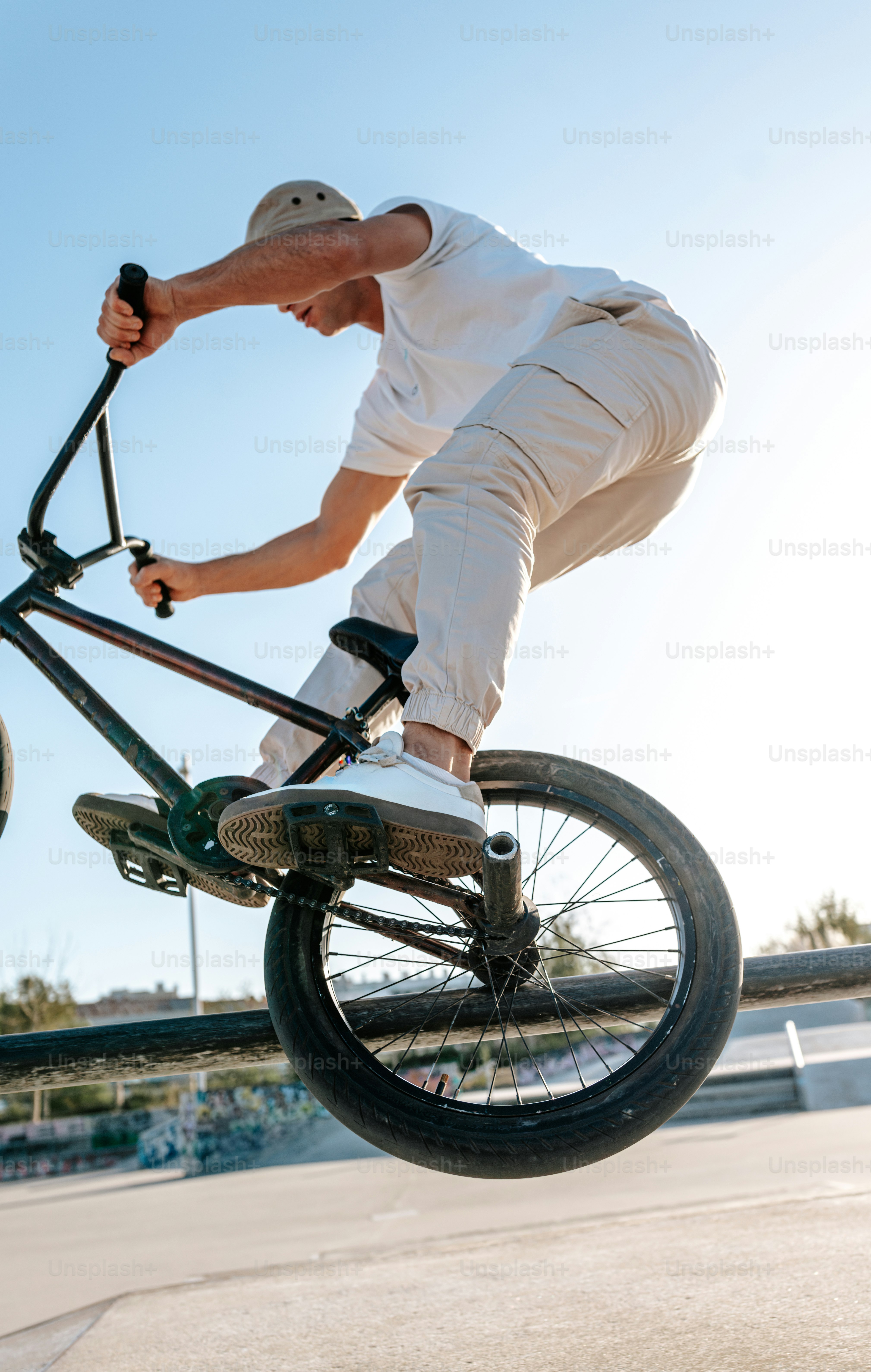 A man on a bike doing a trick in the air