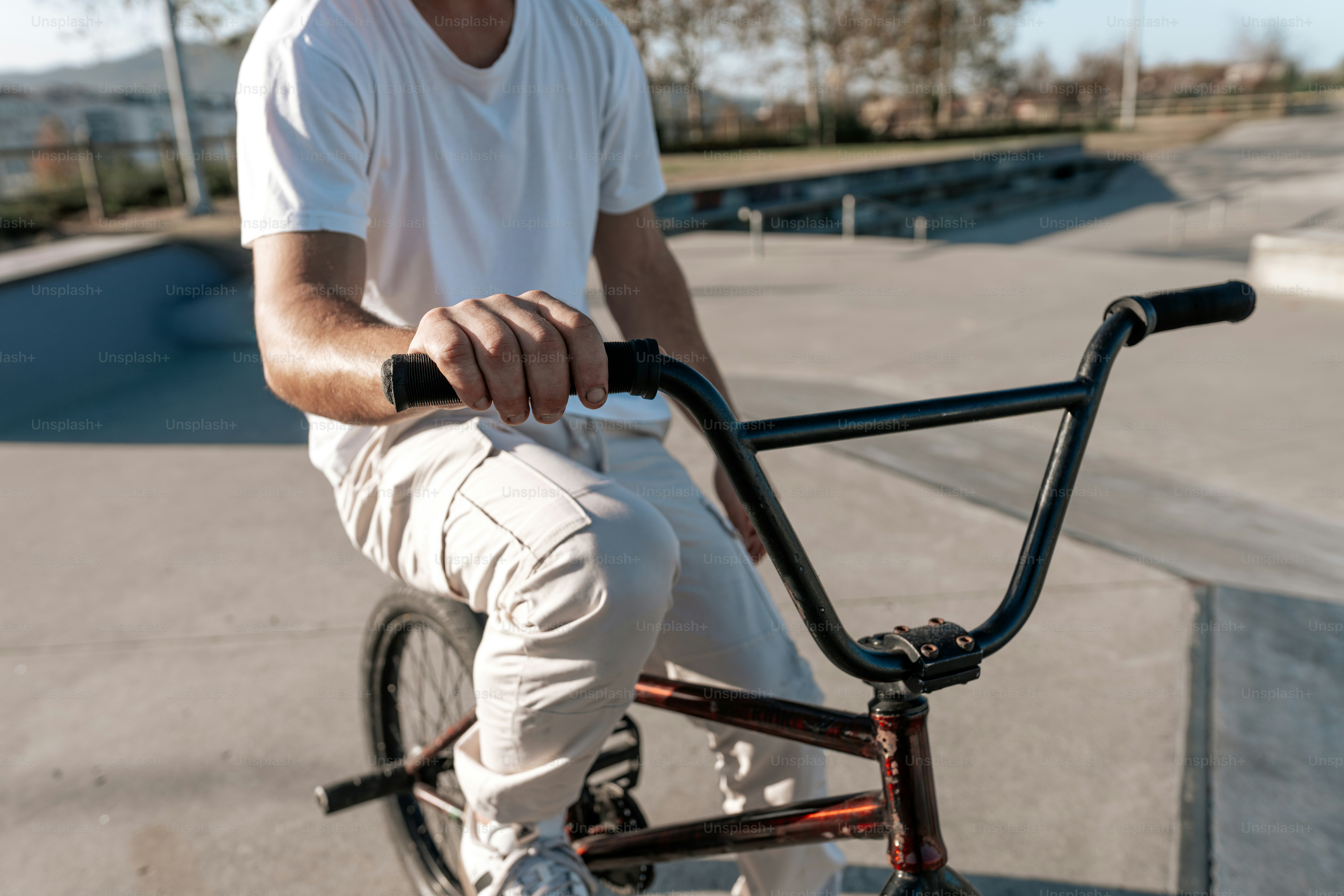 A man riding a bike at a skate park