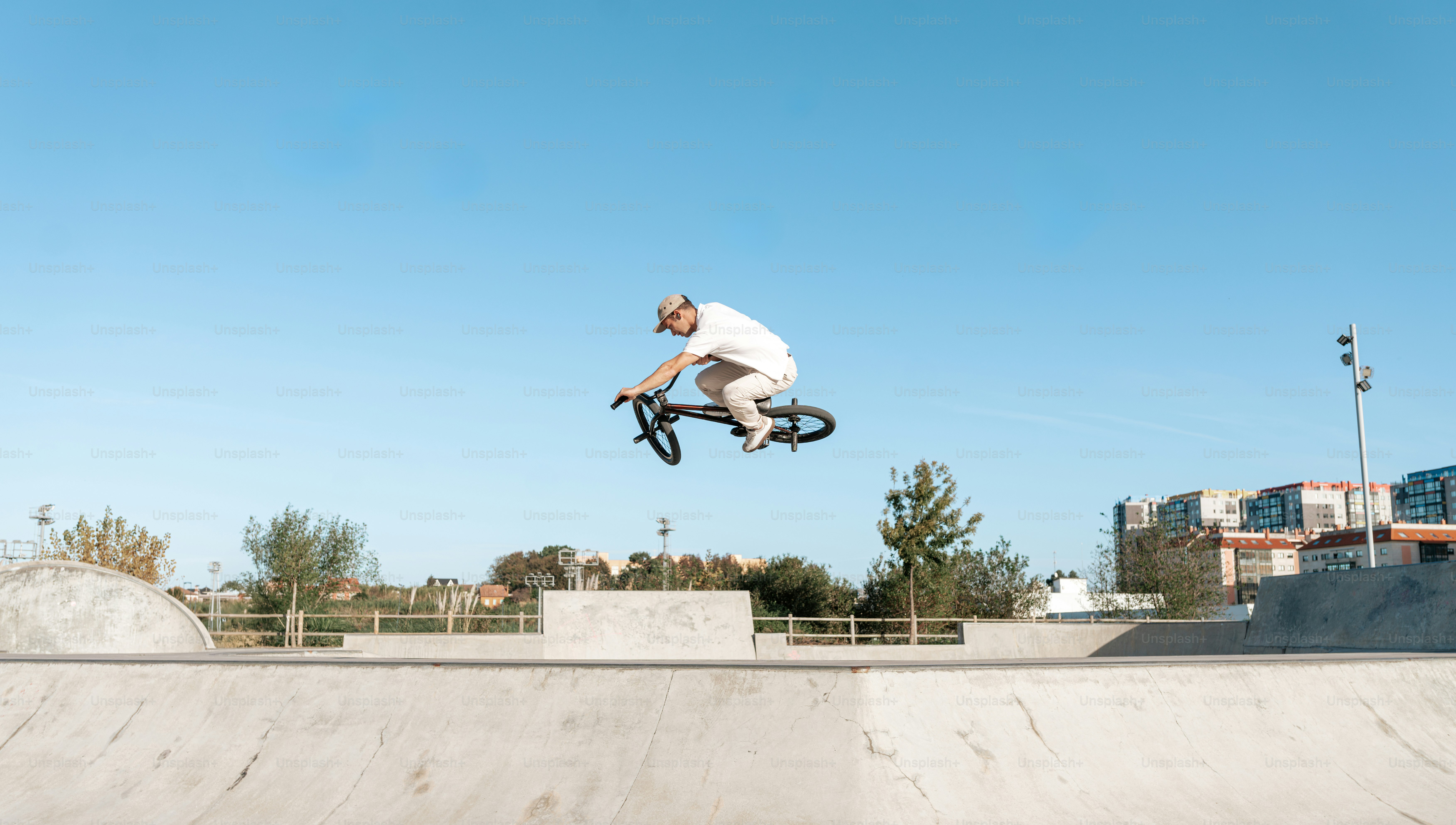 A man flying through the air while riding a skateboard