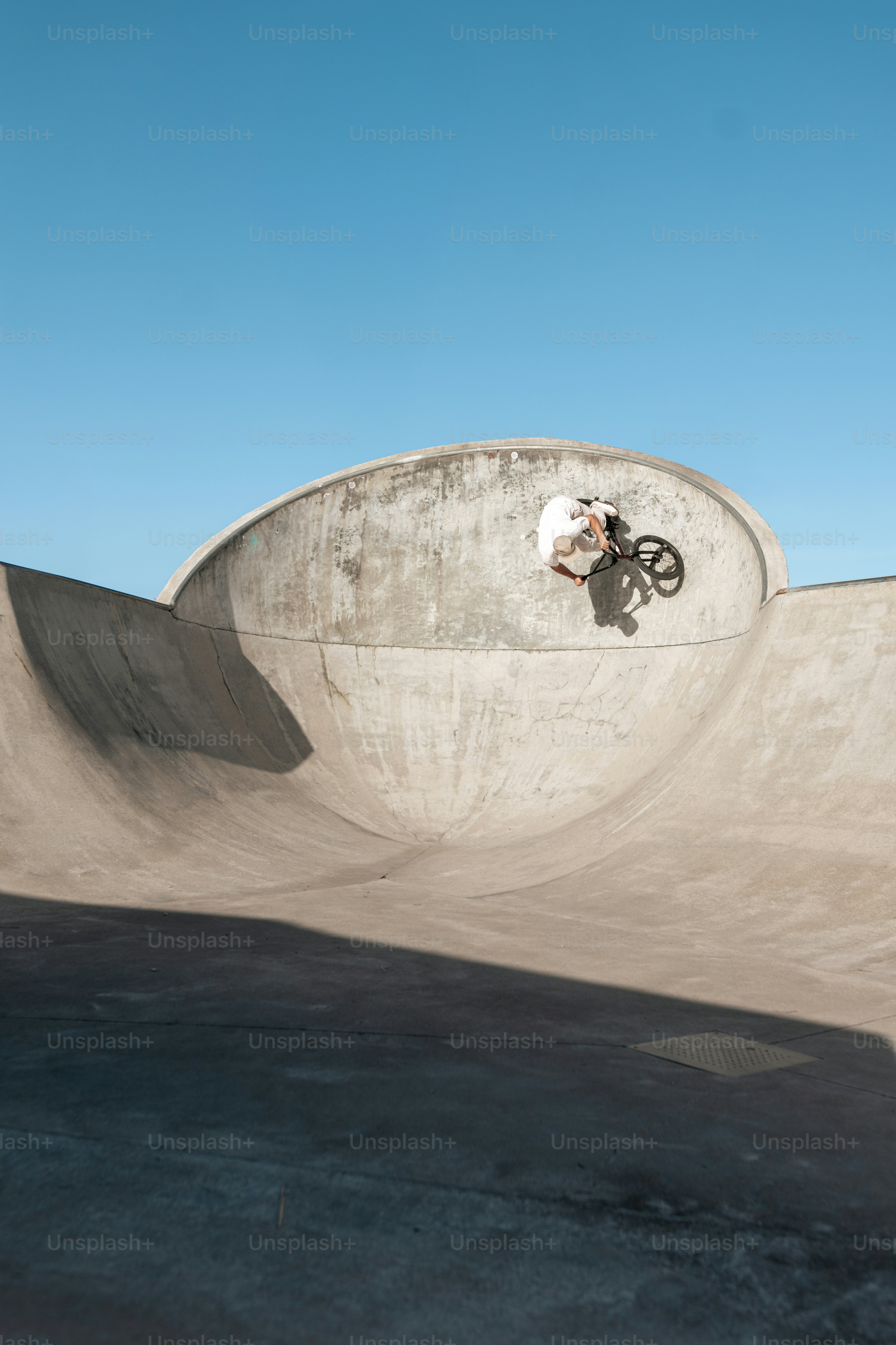 A man riding a skateboard up the side of a ramp