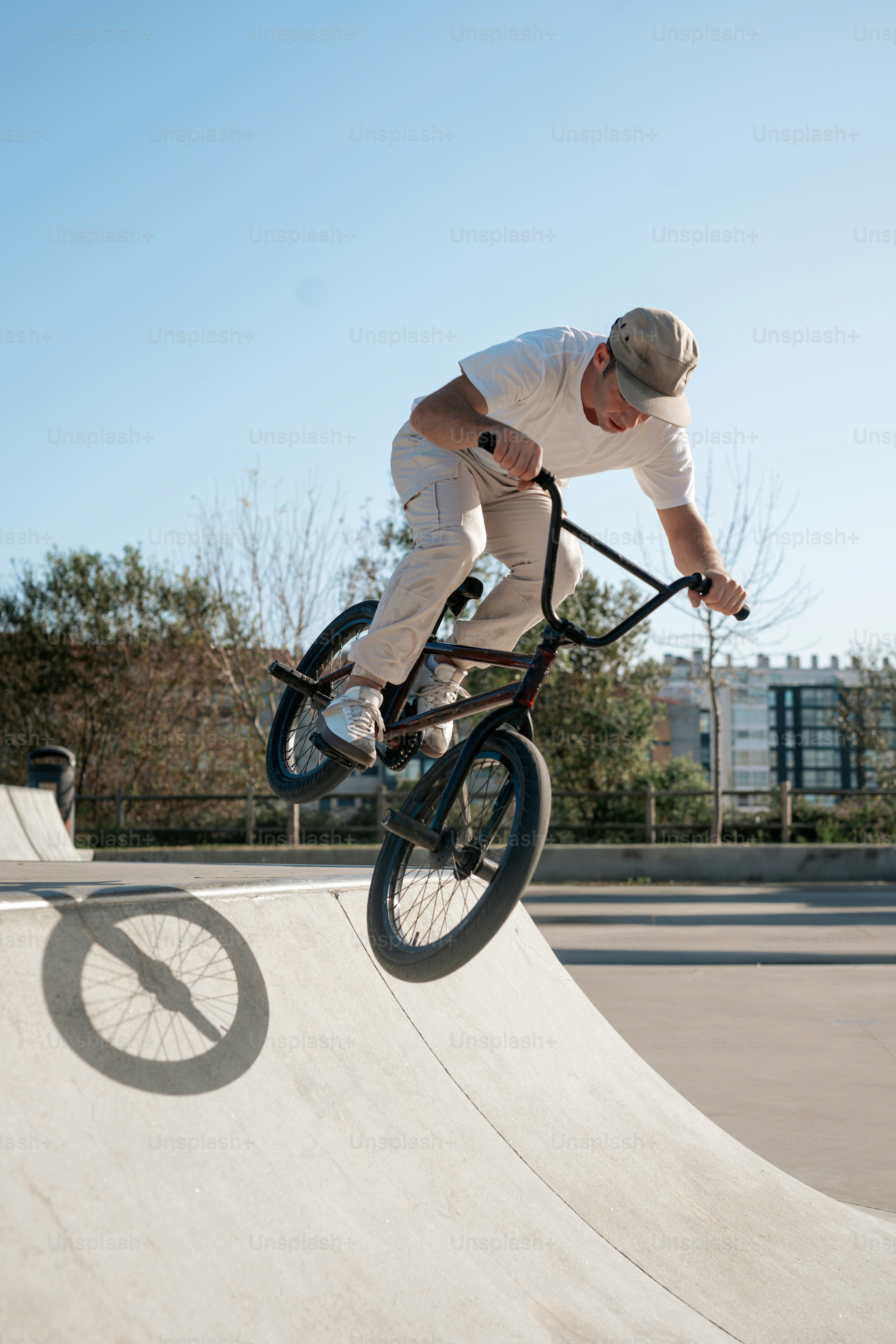 A man riding a skateboard up the side of a ramp
