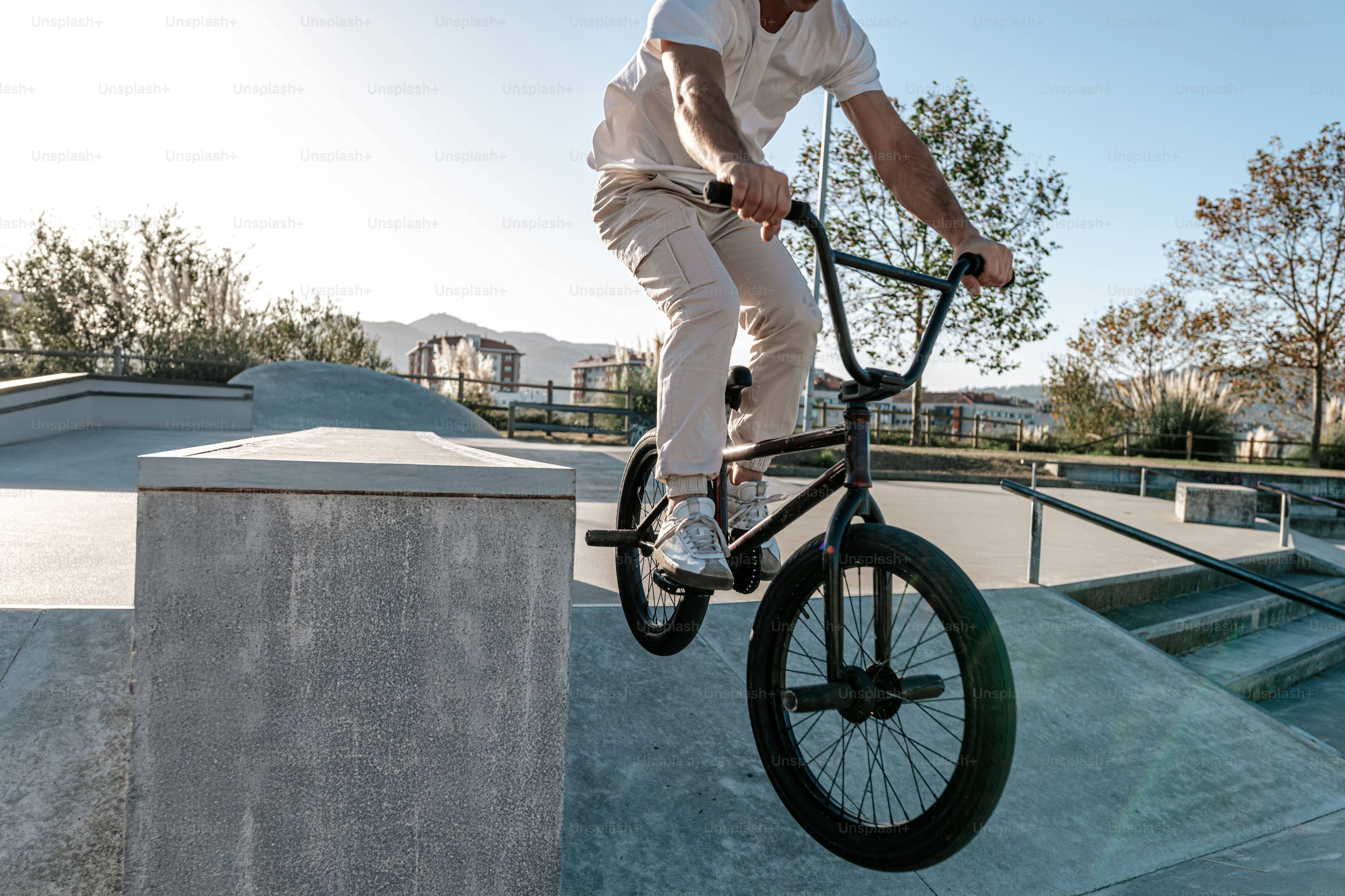 A man riding a bike up the side of a ramp