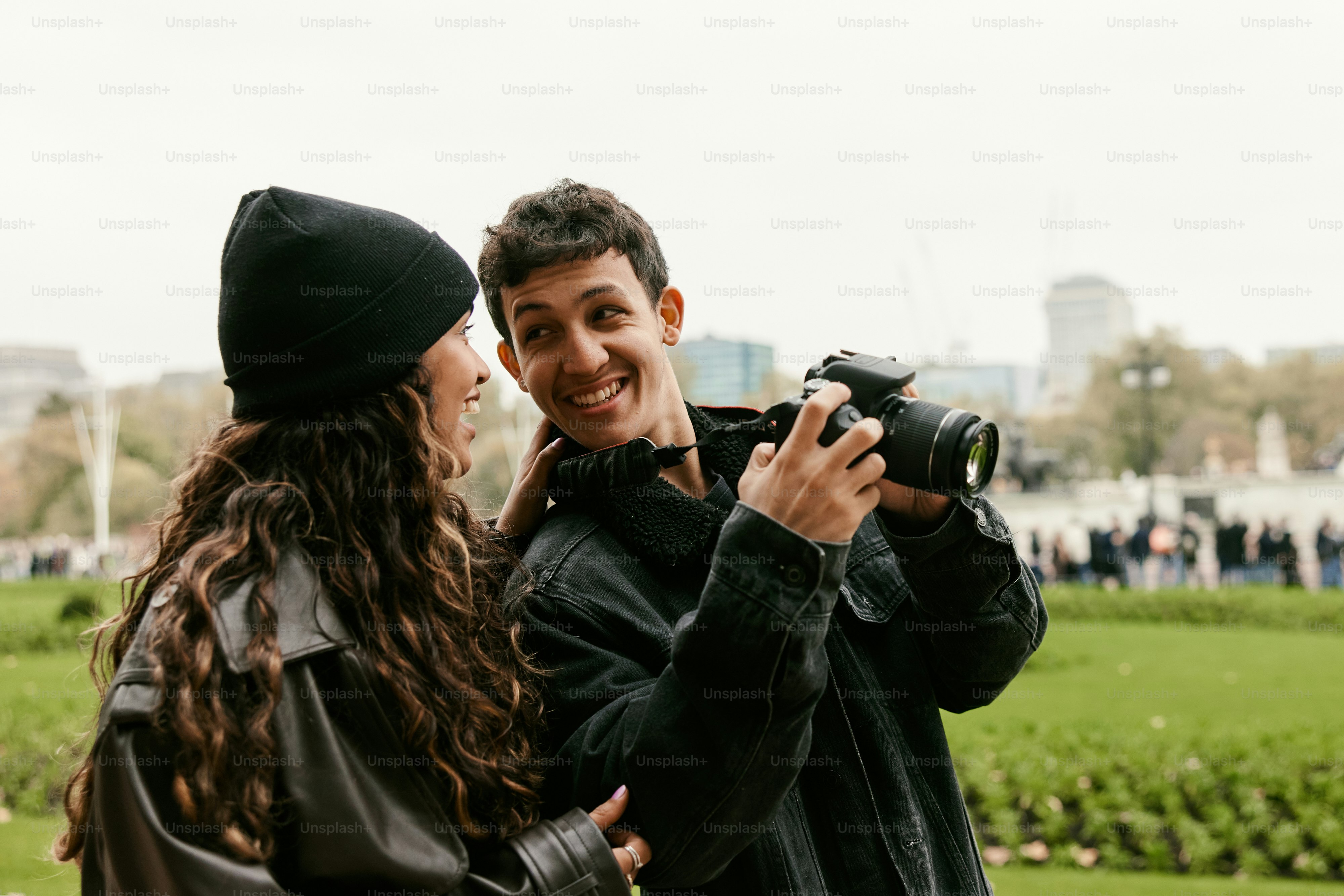 A man taking a picture of a woman with a camera
