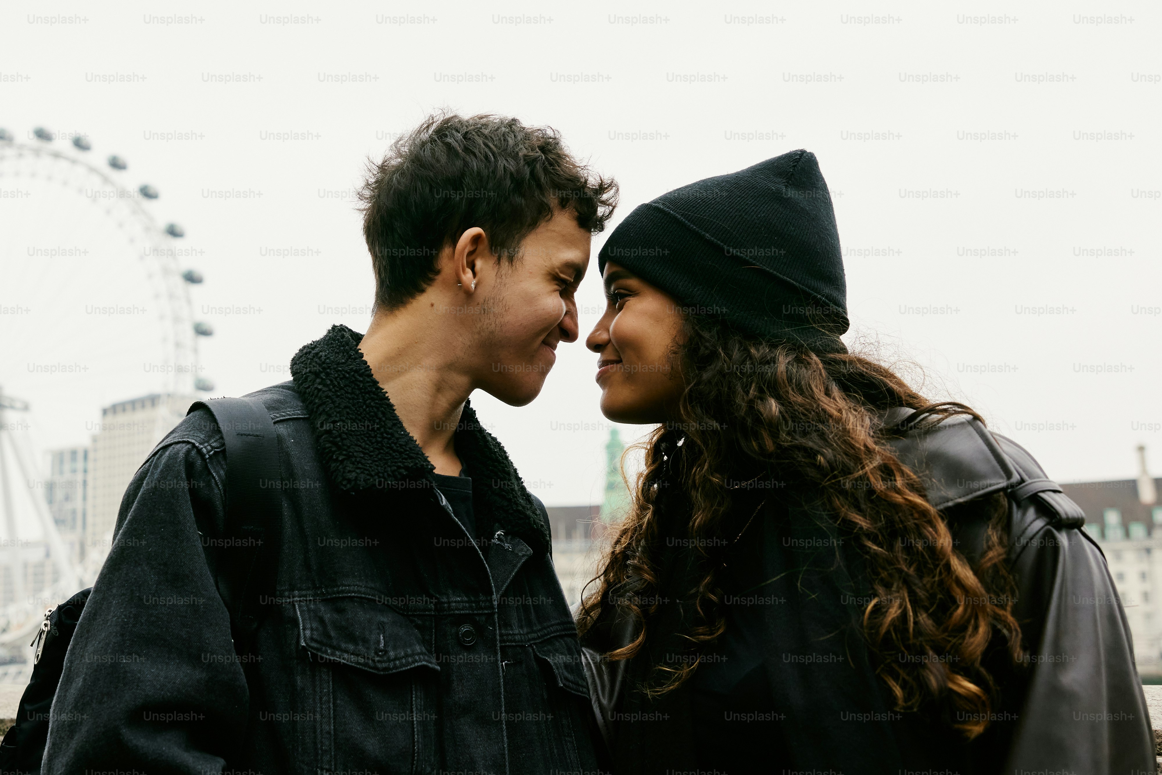 A man and a woman standing next to each other