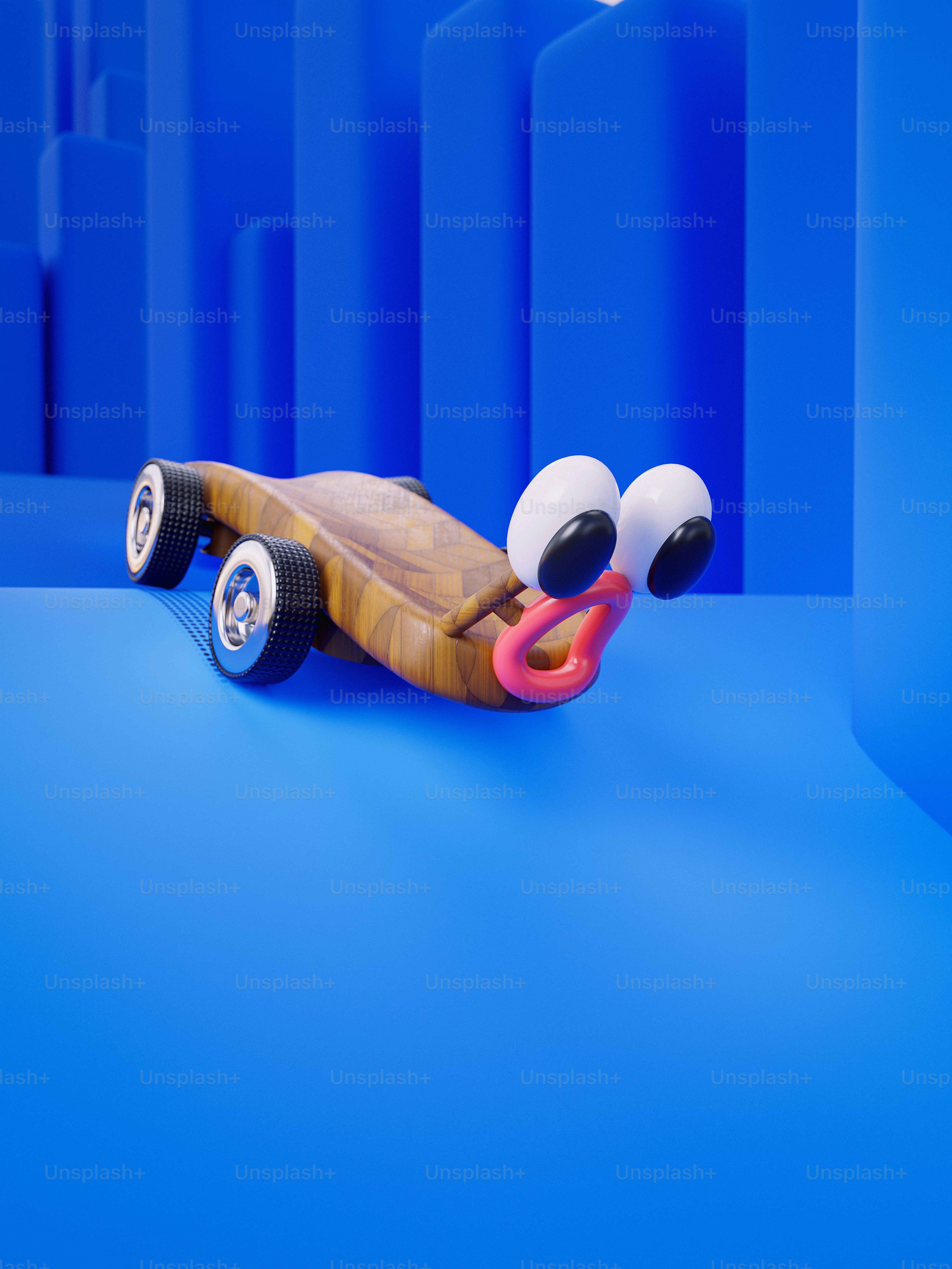 A toy car with eyes and a nose on a blue background