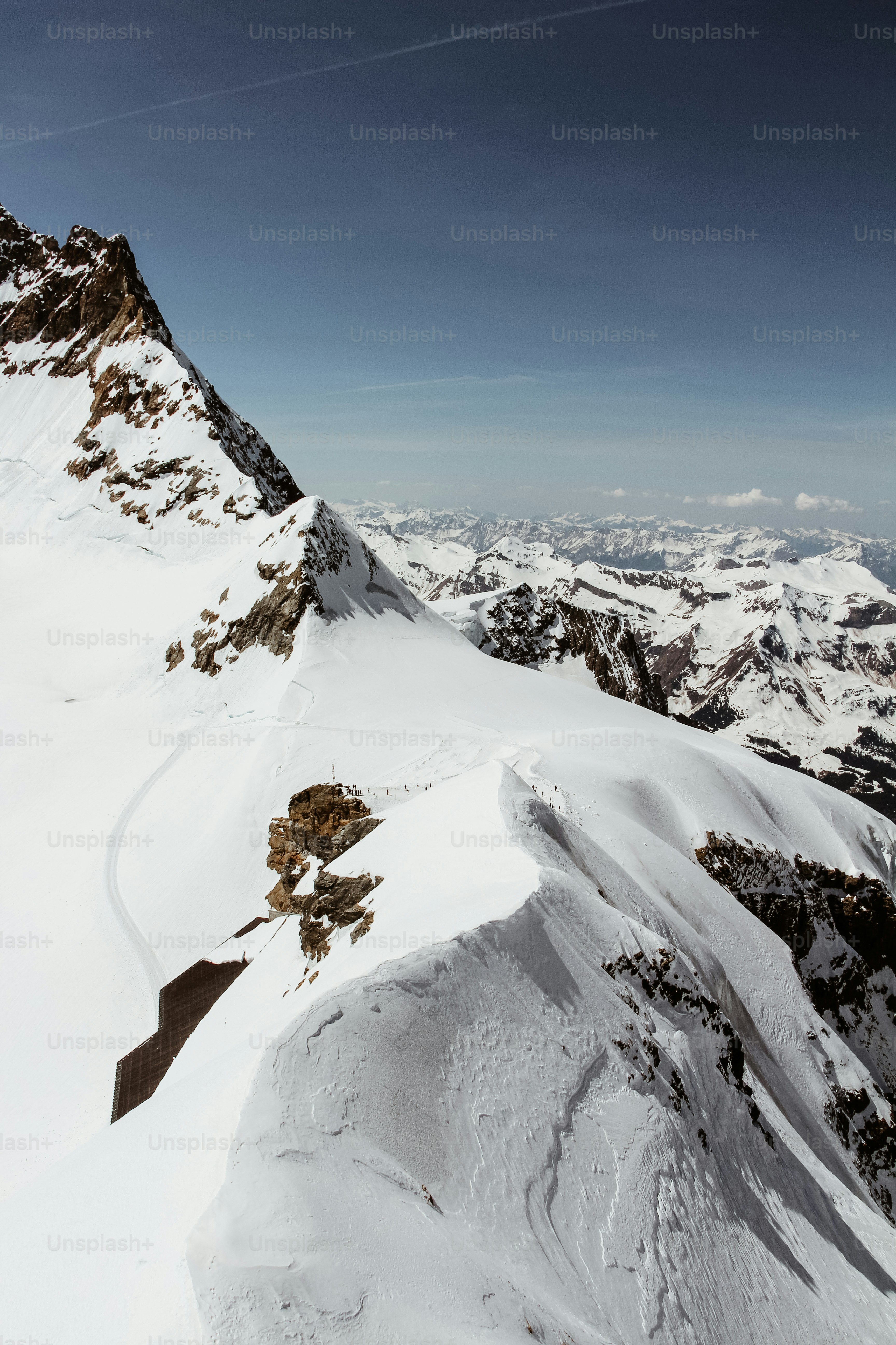 A snow covered mountain with a sky background