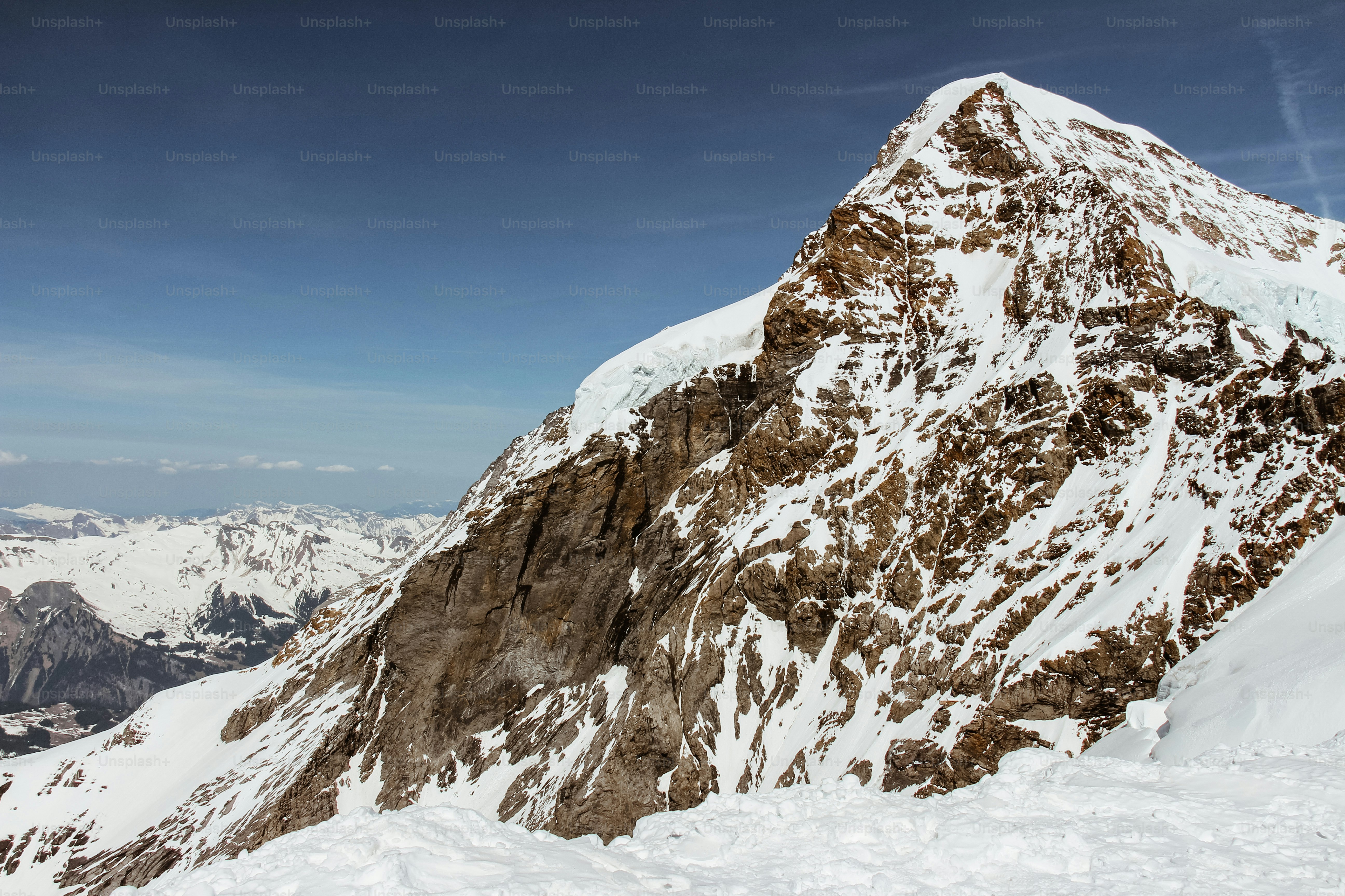 A snow covered mountain with a sky background