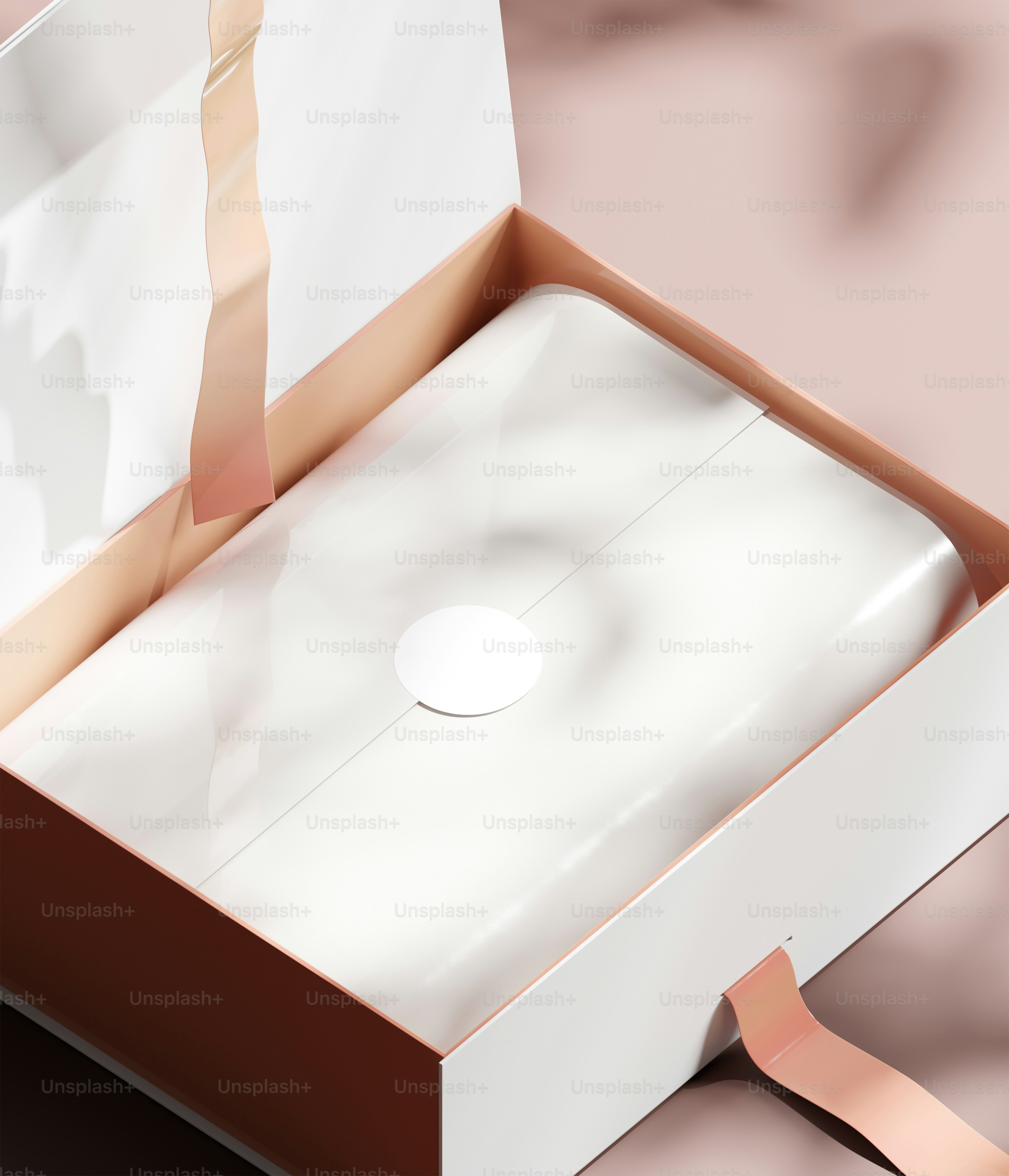 A white box with a ribbon in it