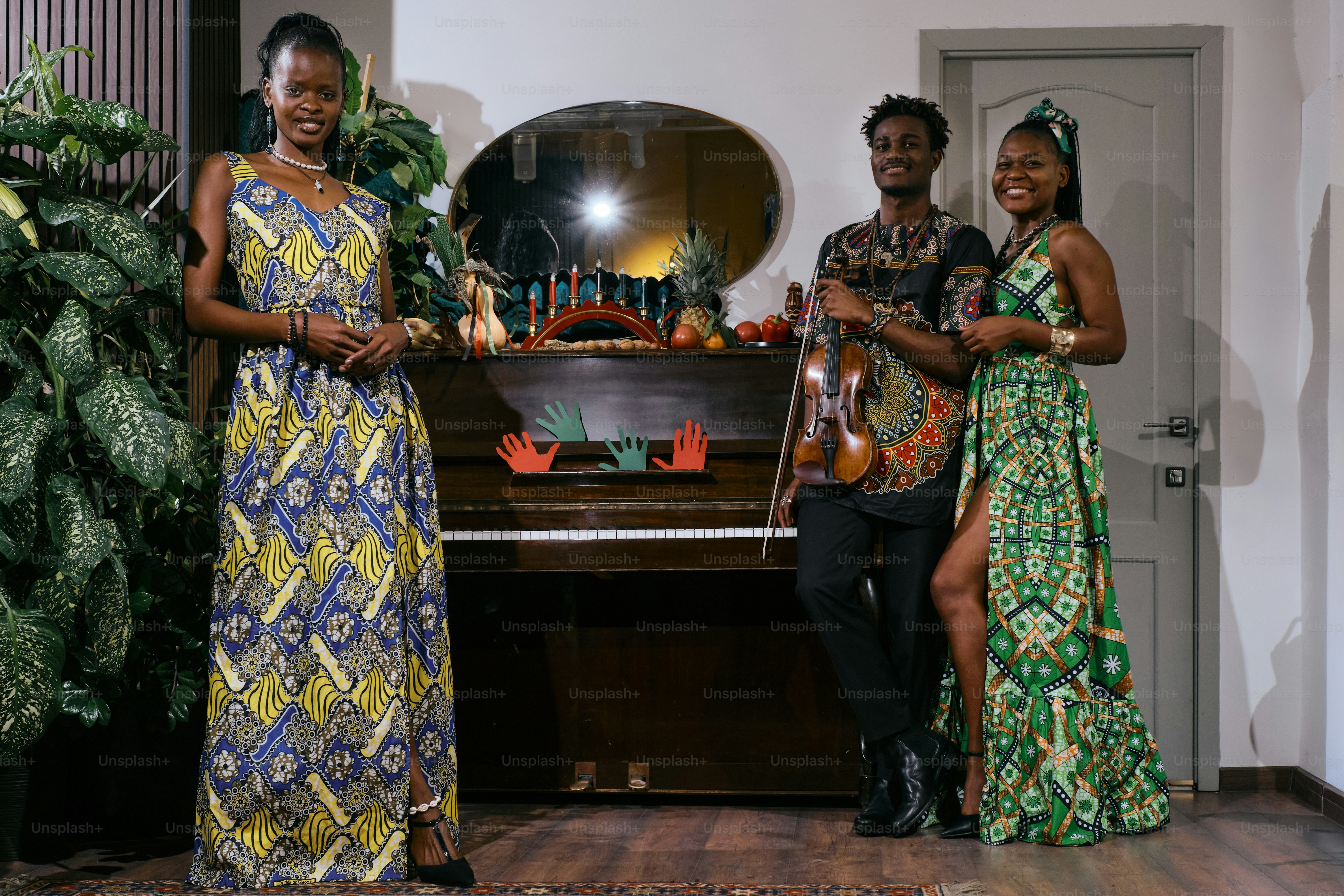 A group of people standing next to a piano