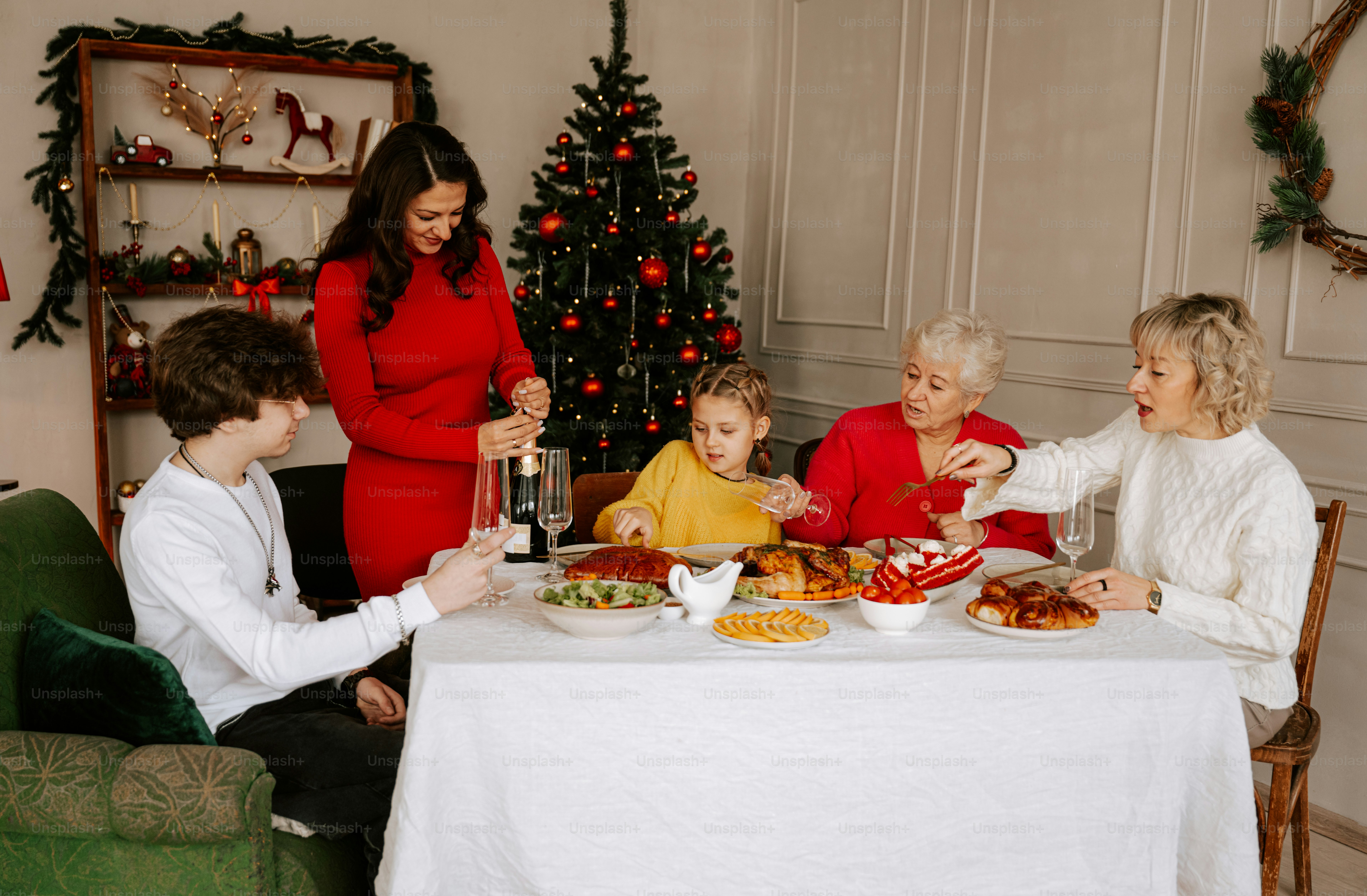 A group of people sitting around a table with food
