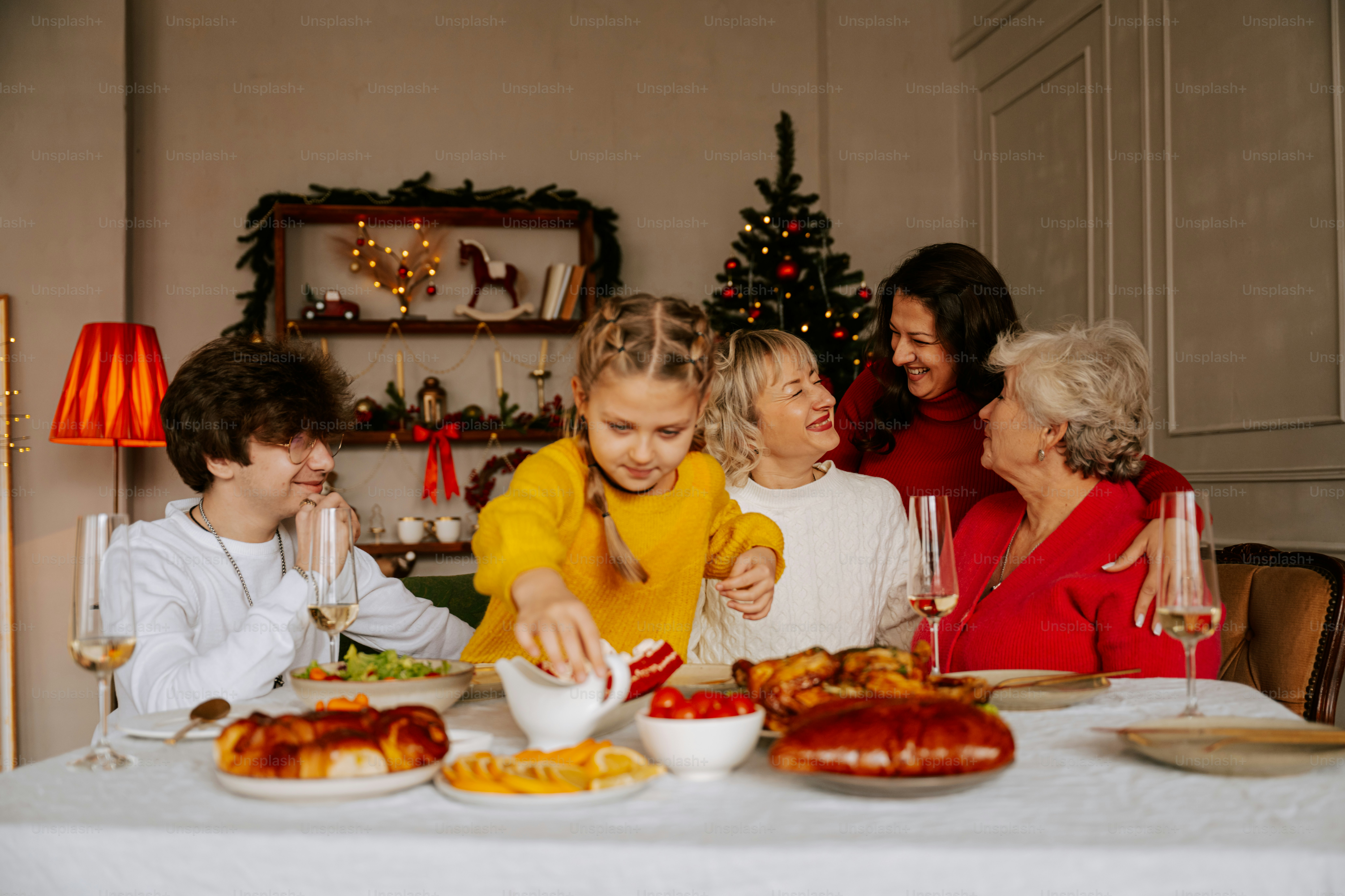 A group of people sitting around a table eating food