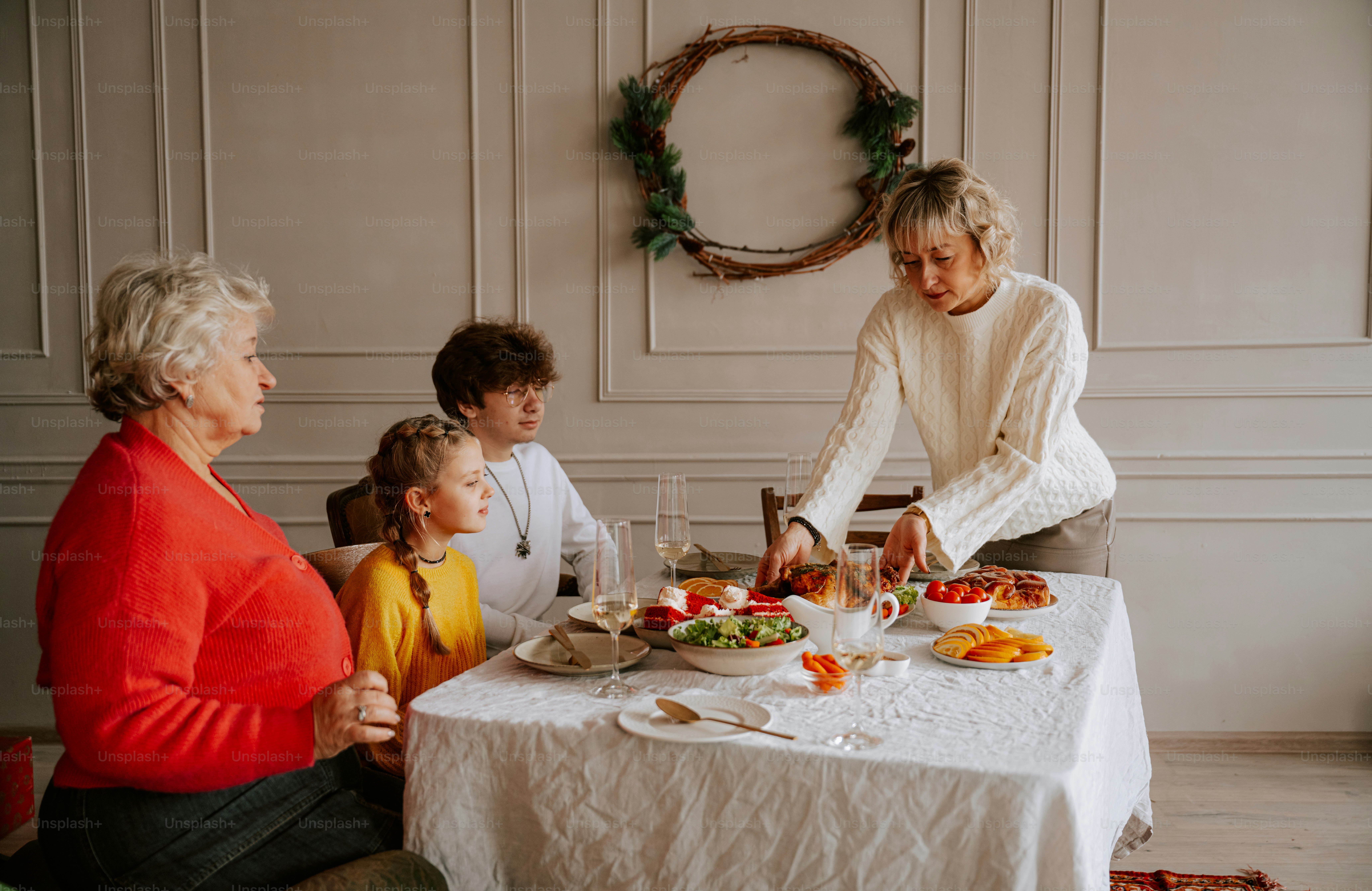 A group of people that are sitting around a table