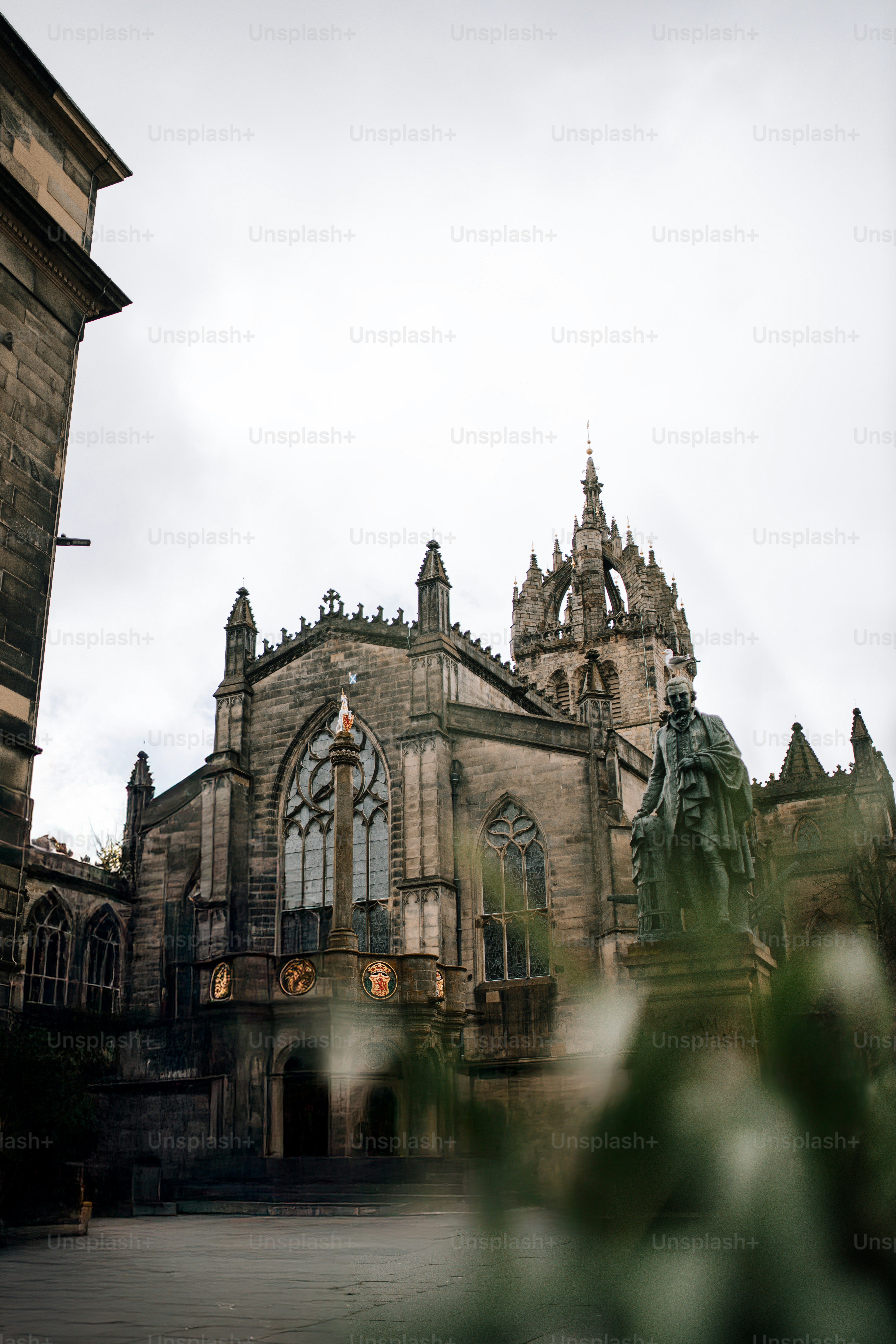 An old building with a statue in front of it