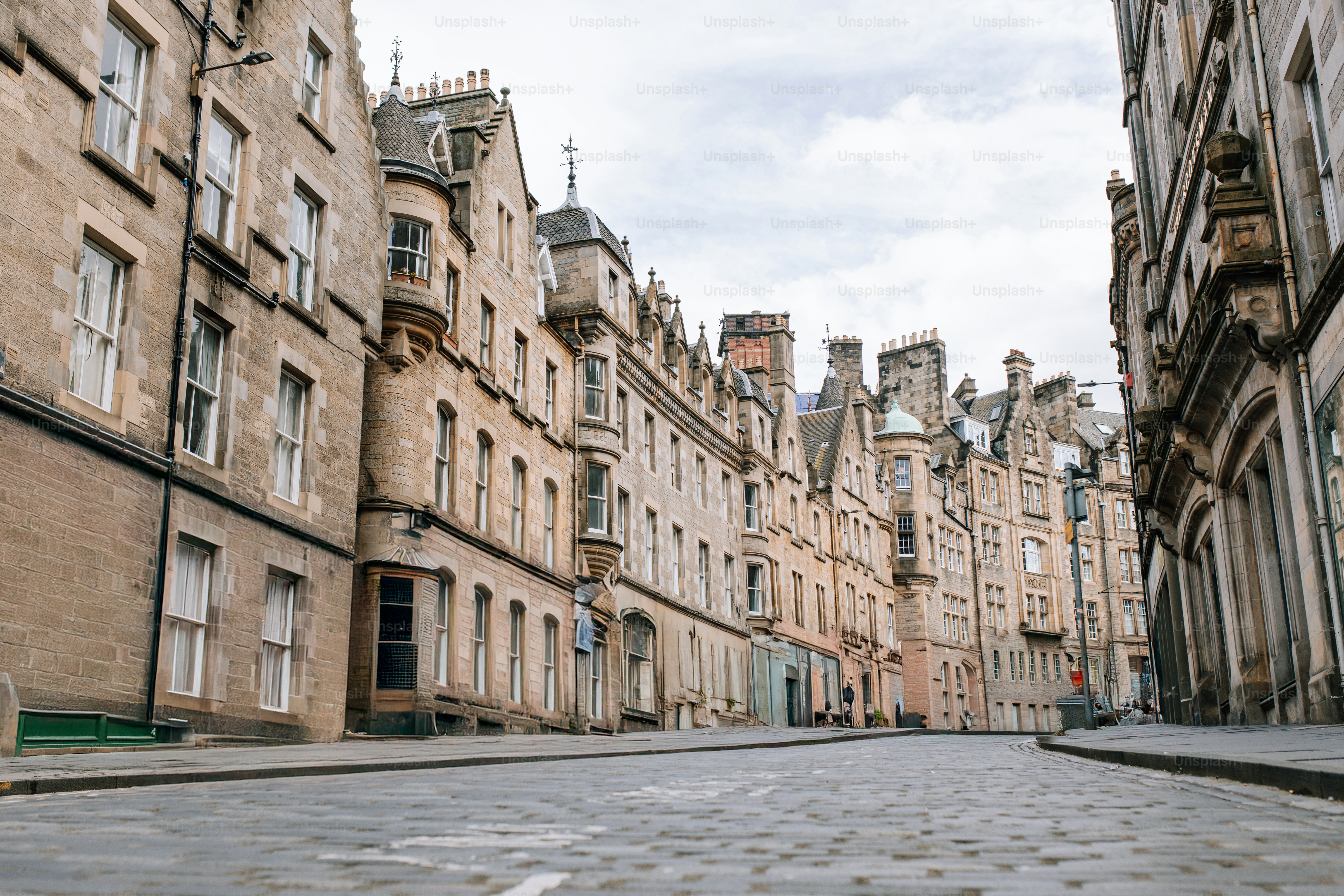 A city street with old buildings and cobblestones