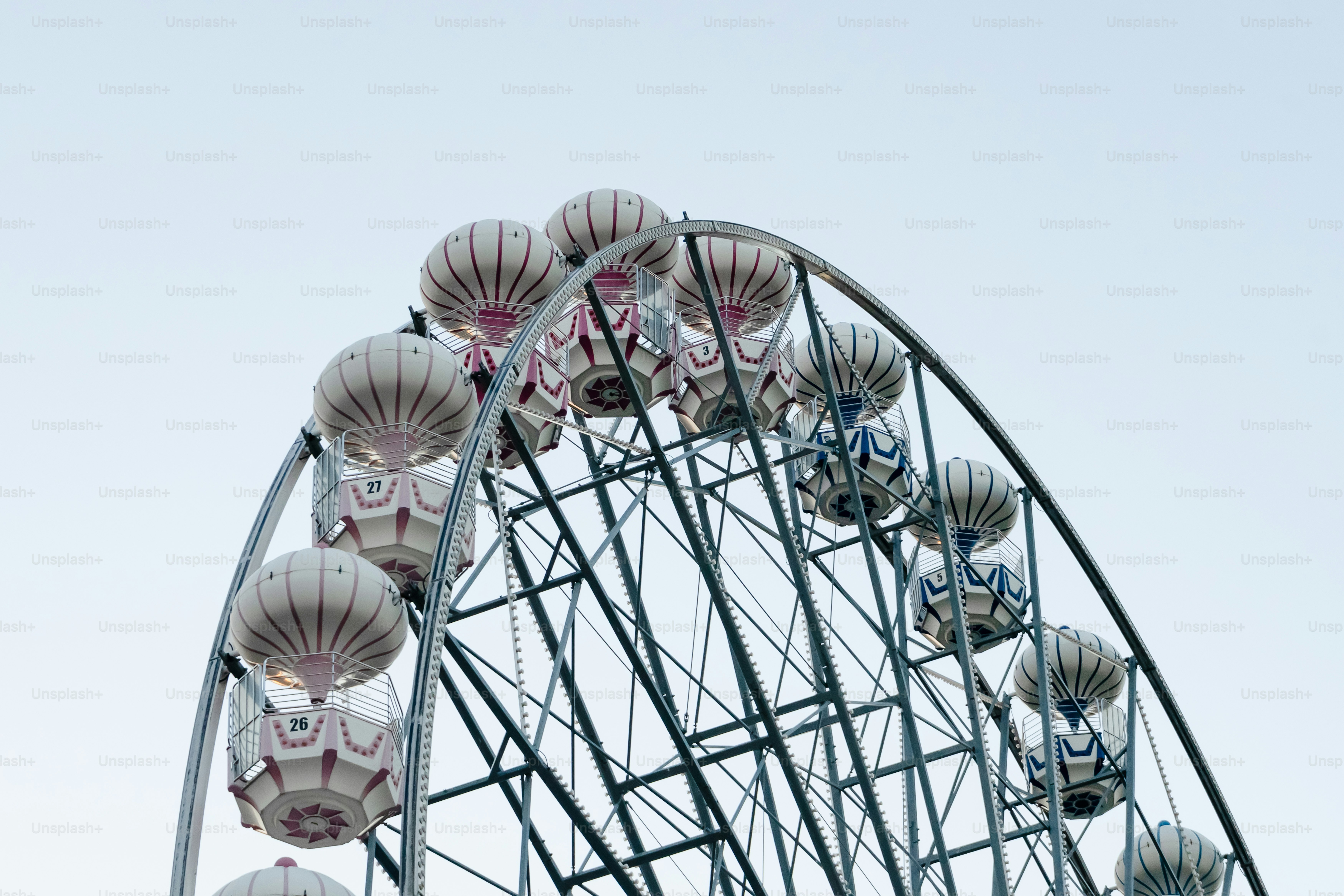 A large ferris wheel with lots of lights on top of it