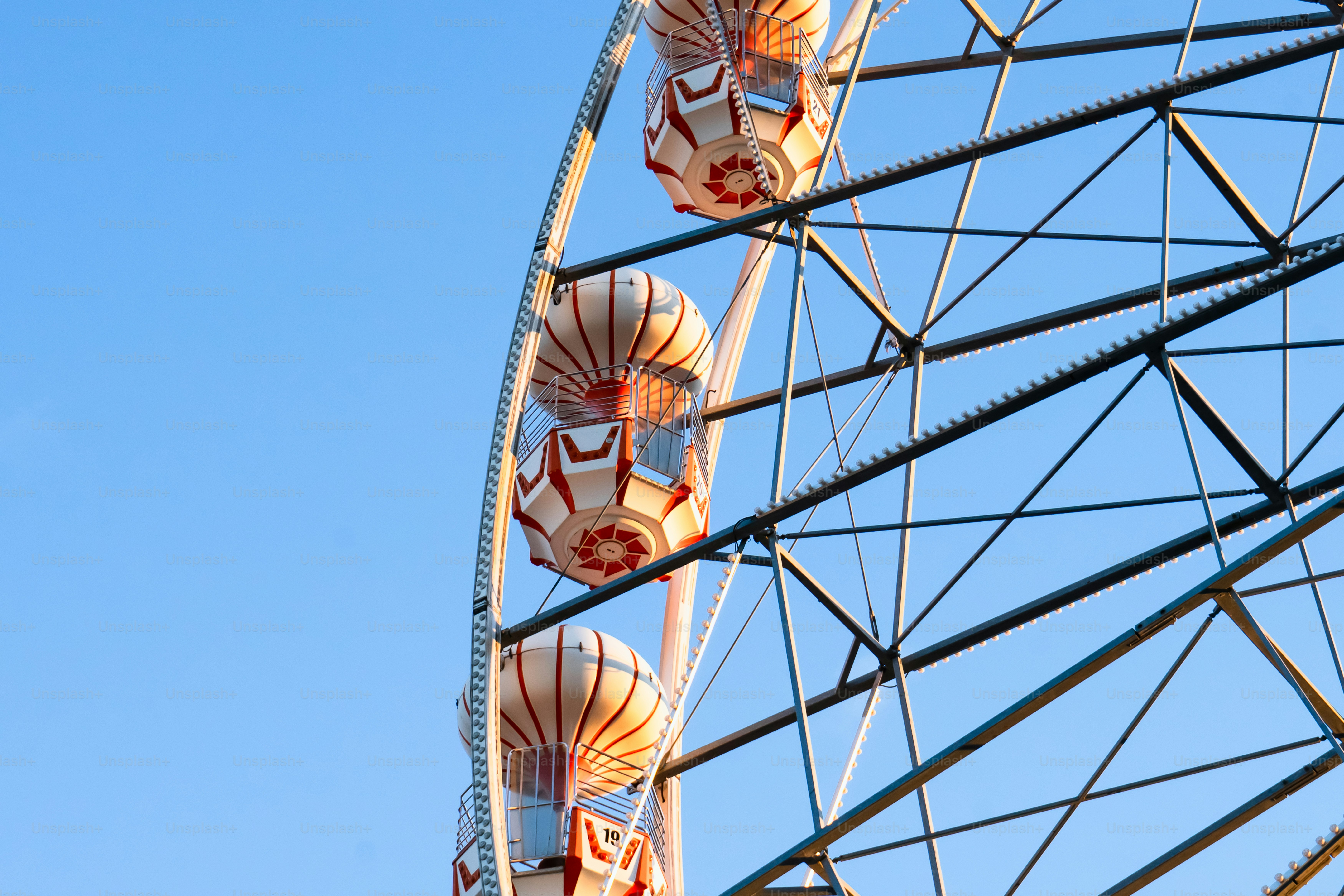 A large ferris wheel with a blue sky in the background