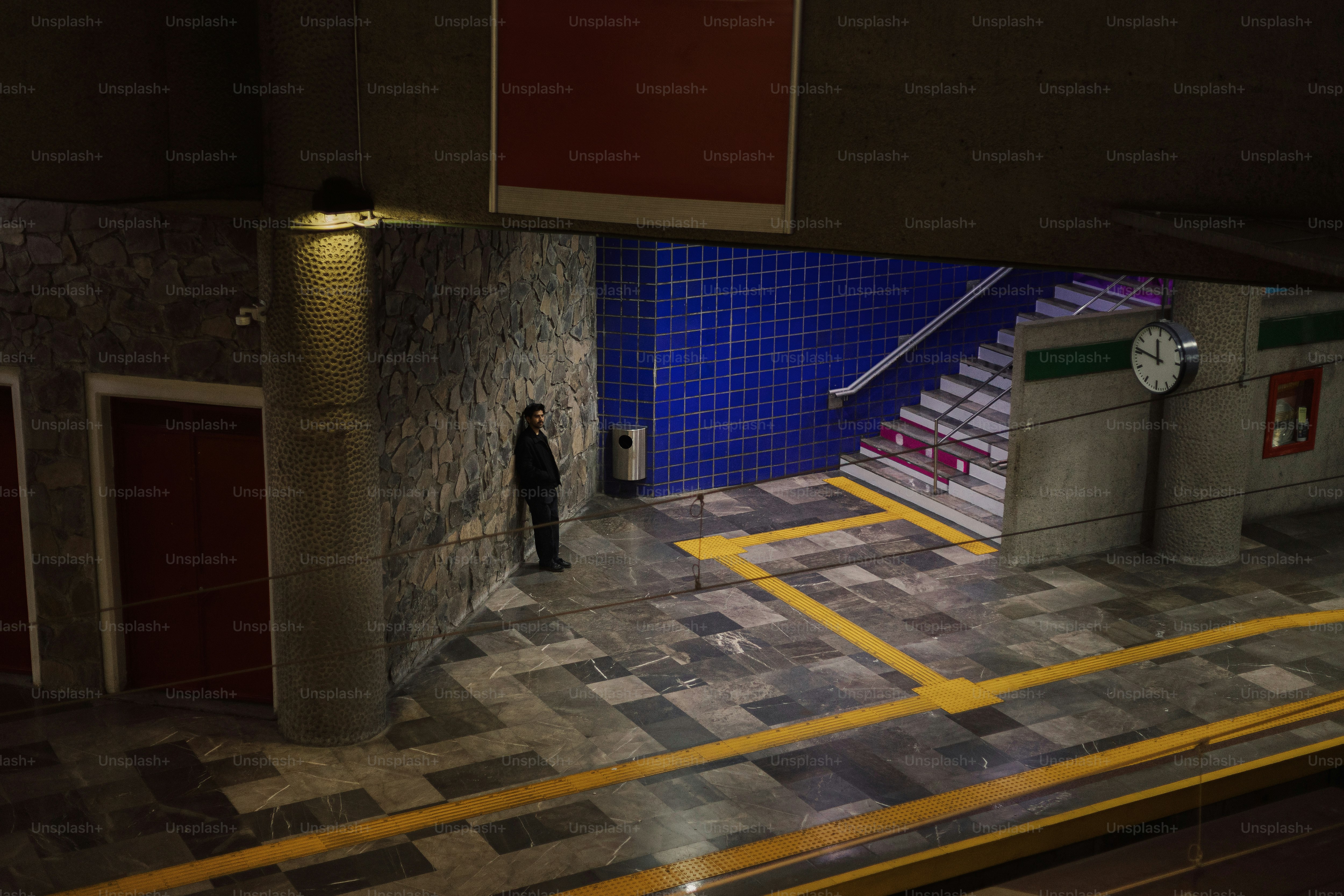 A man standing at the entrance of a building