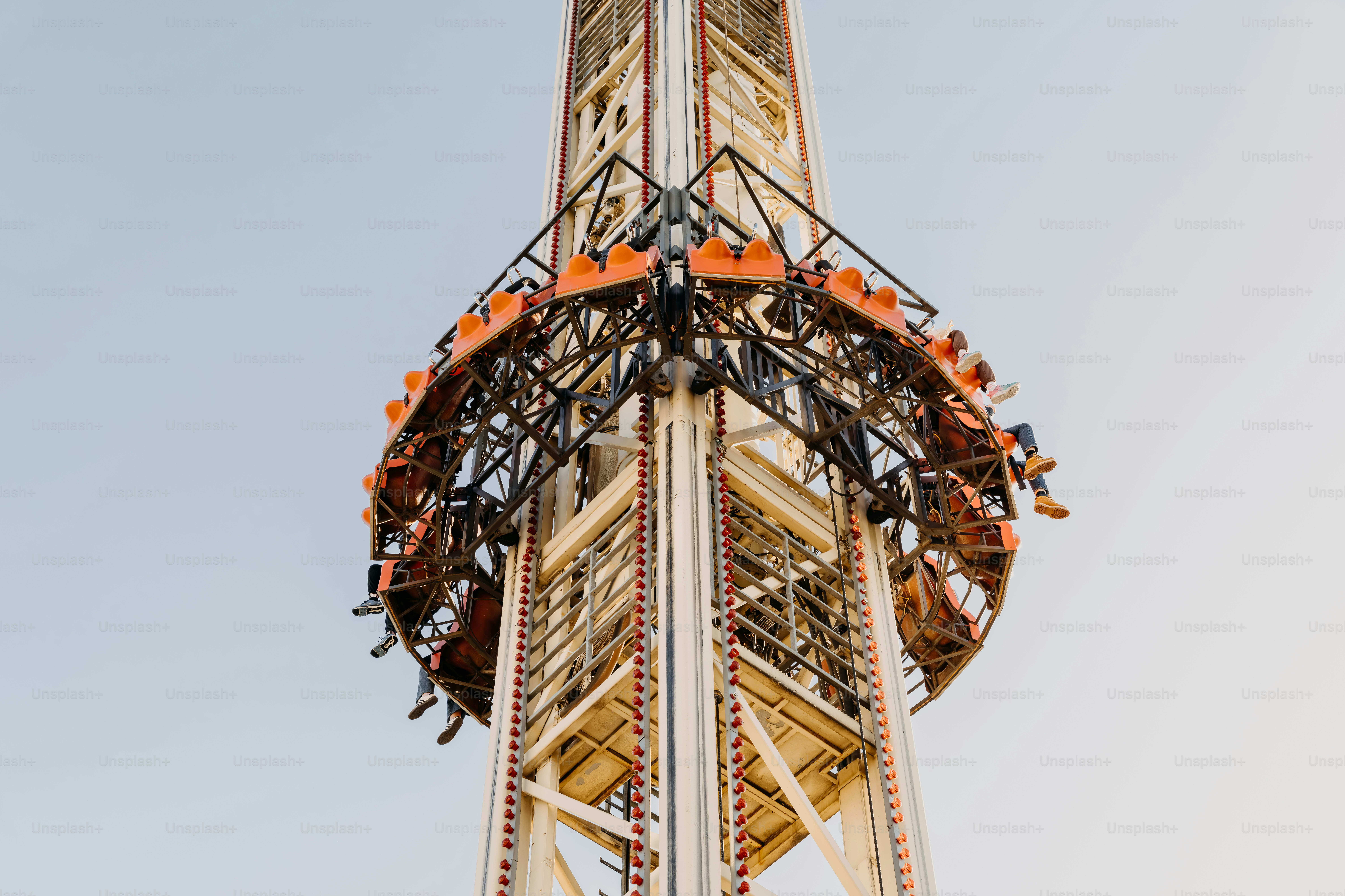 A tall tower with a sky background photo – Fairground ride Image on ...