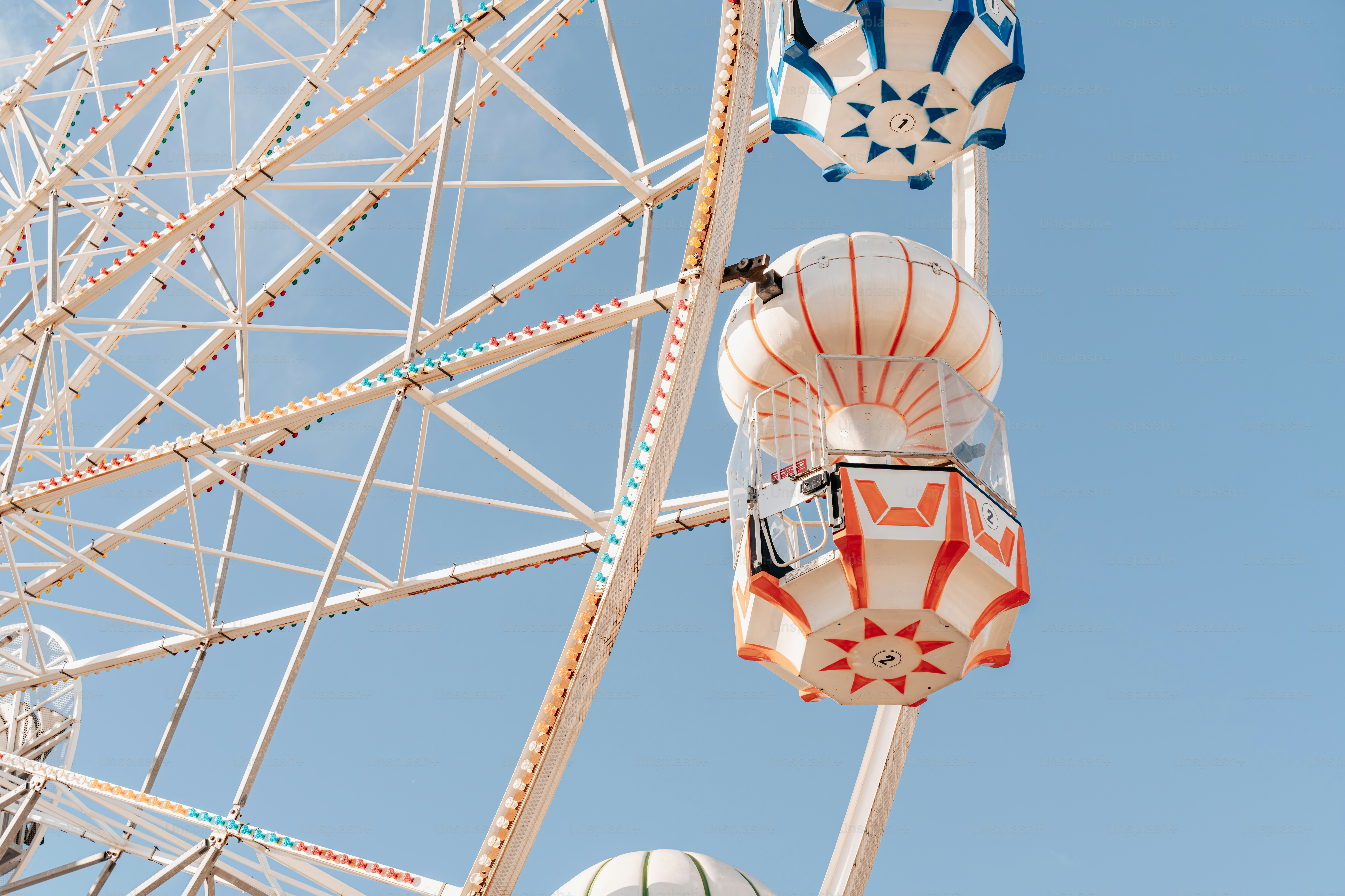 A ferris wheel with a blue sky in the background