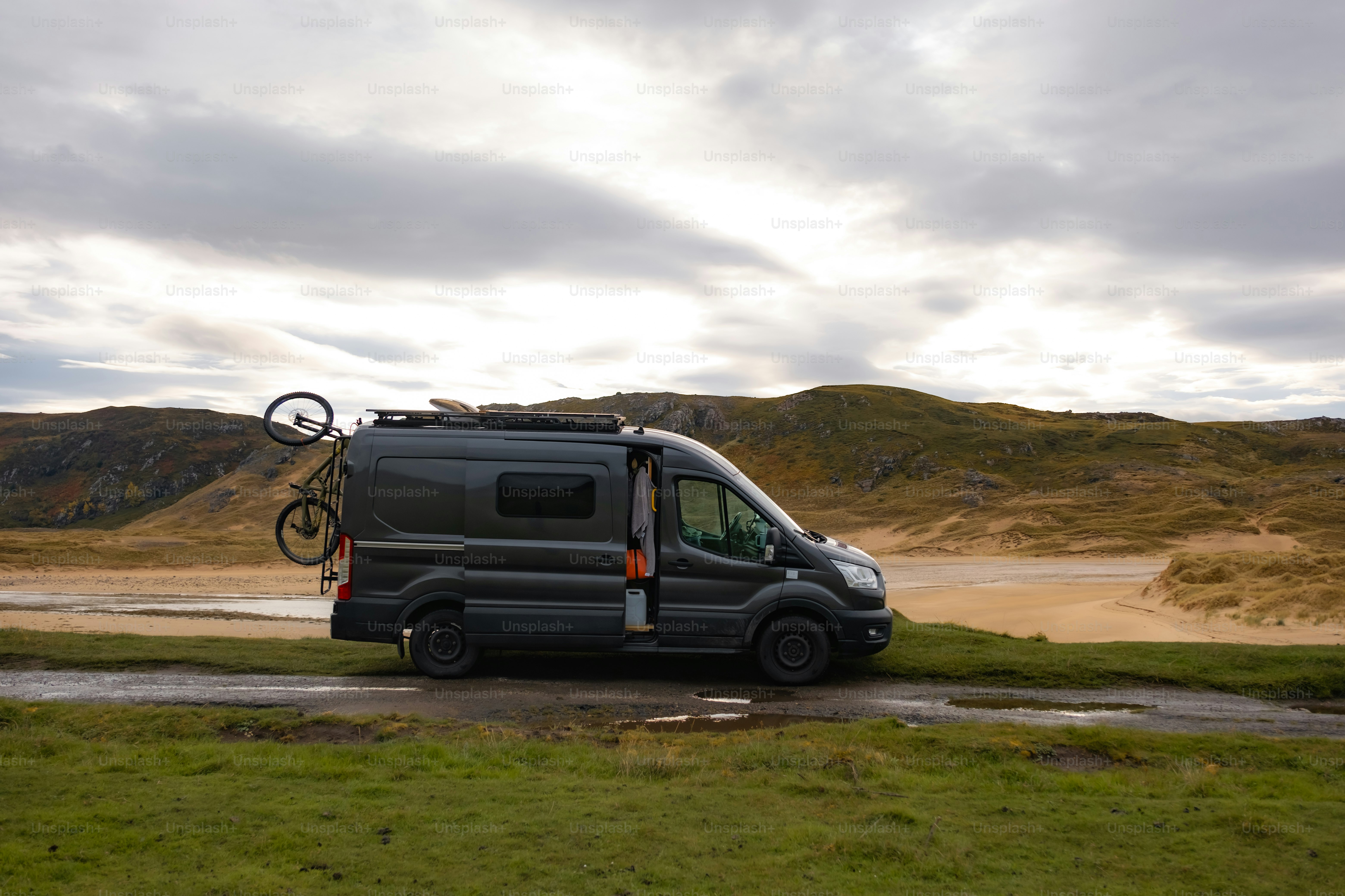 A van with a bike on the back of it