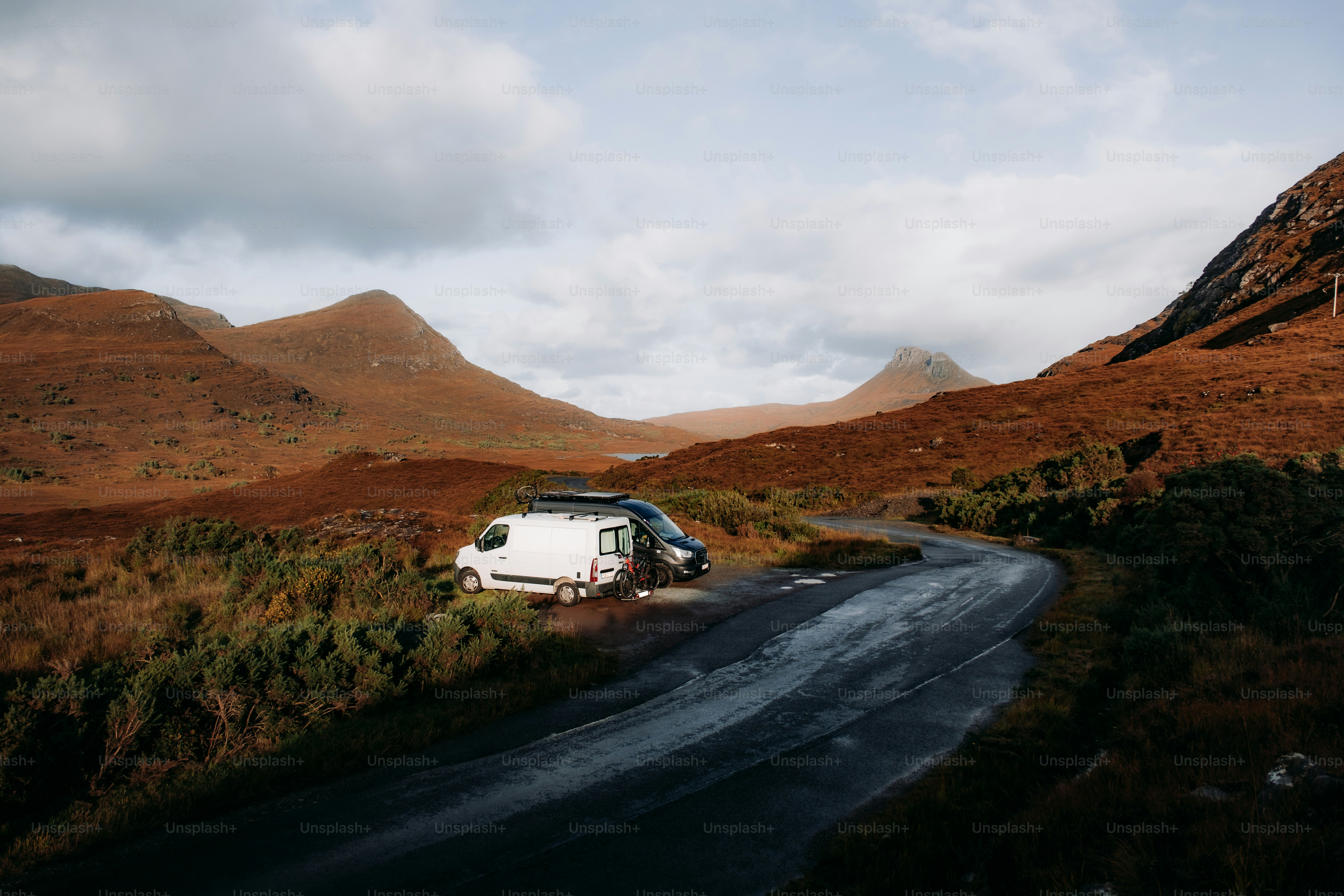 A van is parked on the side of a road