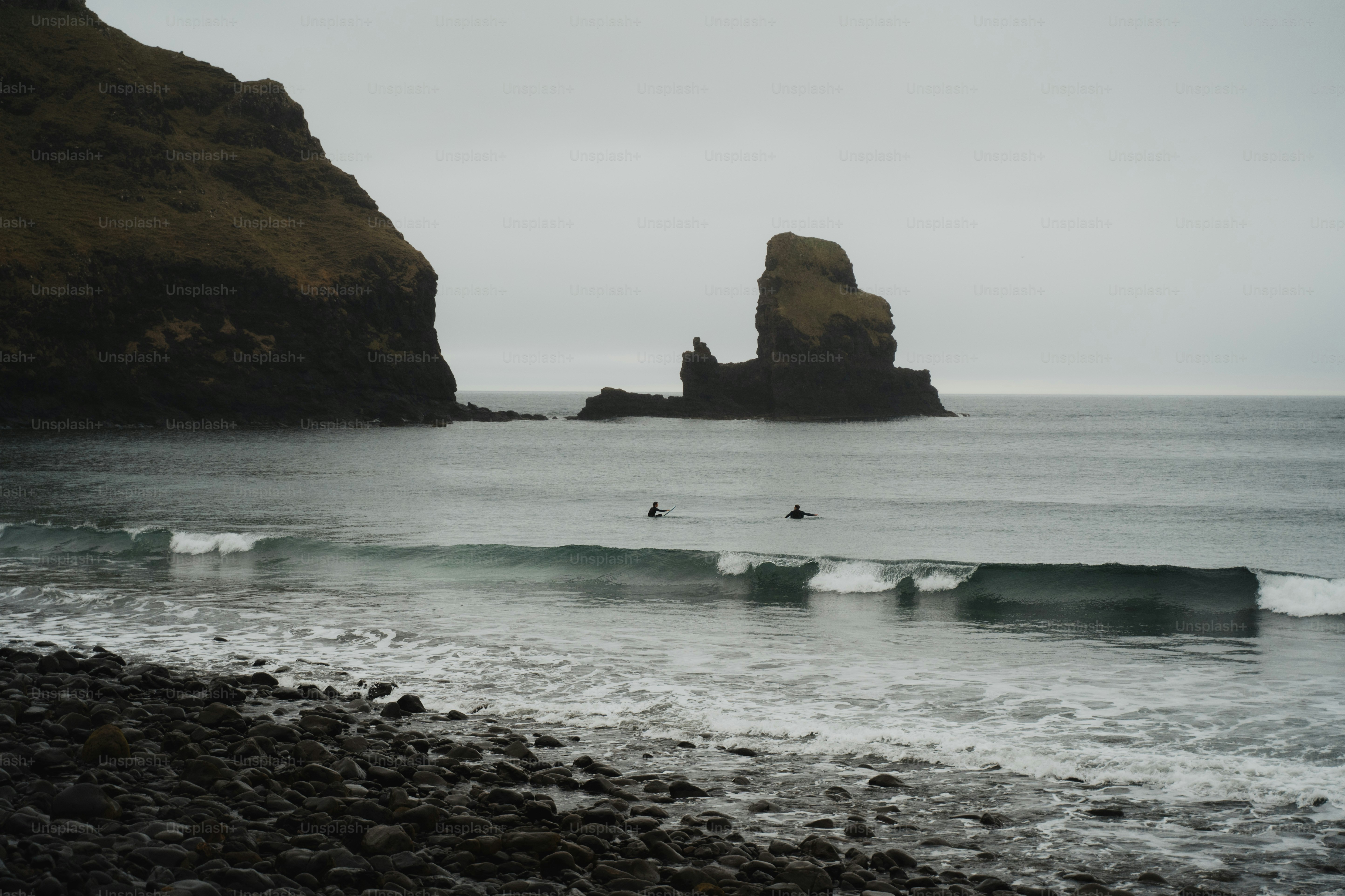 A person riding a surfboard on a body of water