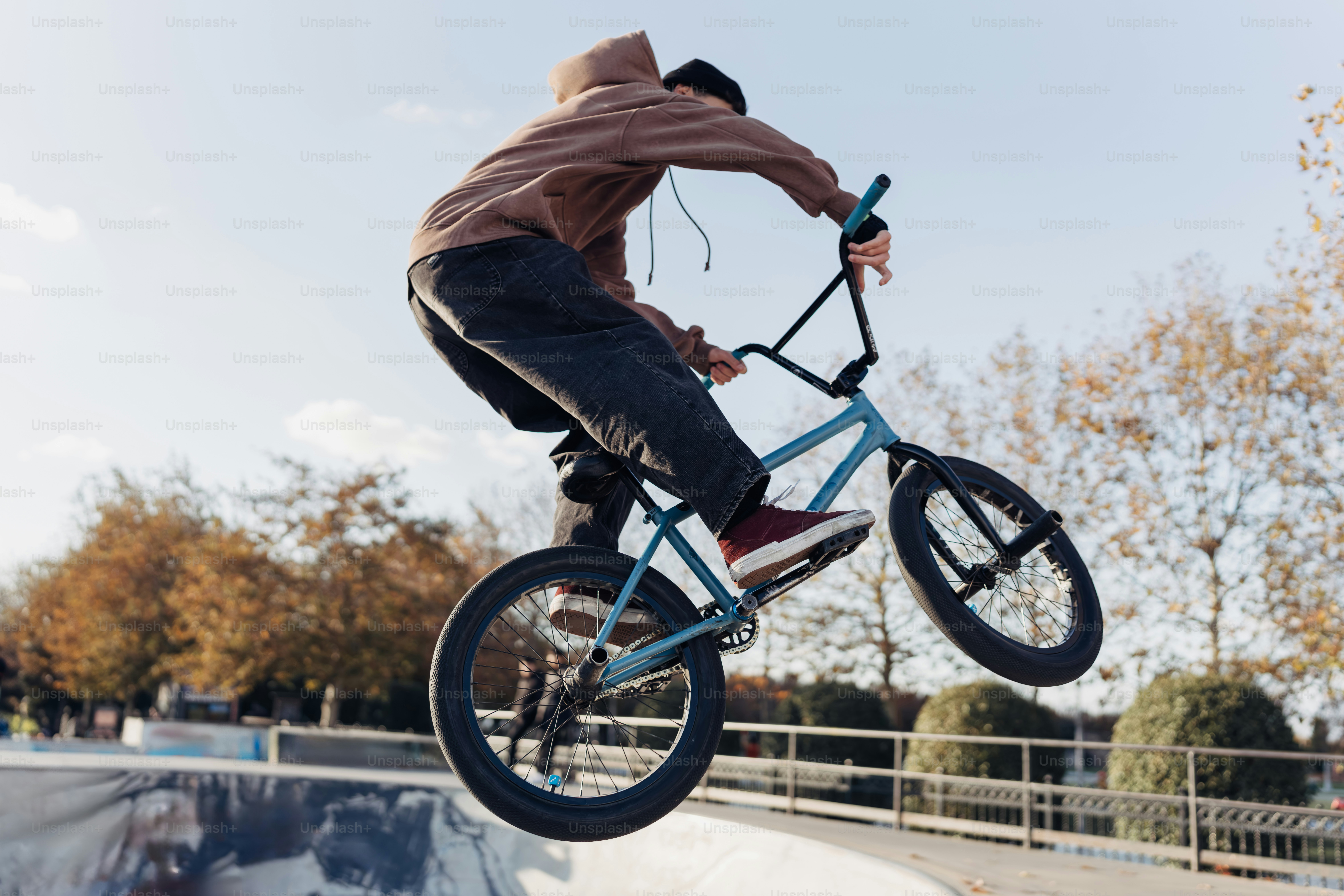 A man riding a bike up the side of a ramp photo – Sport Image on Unsplash