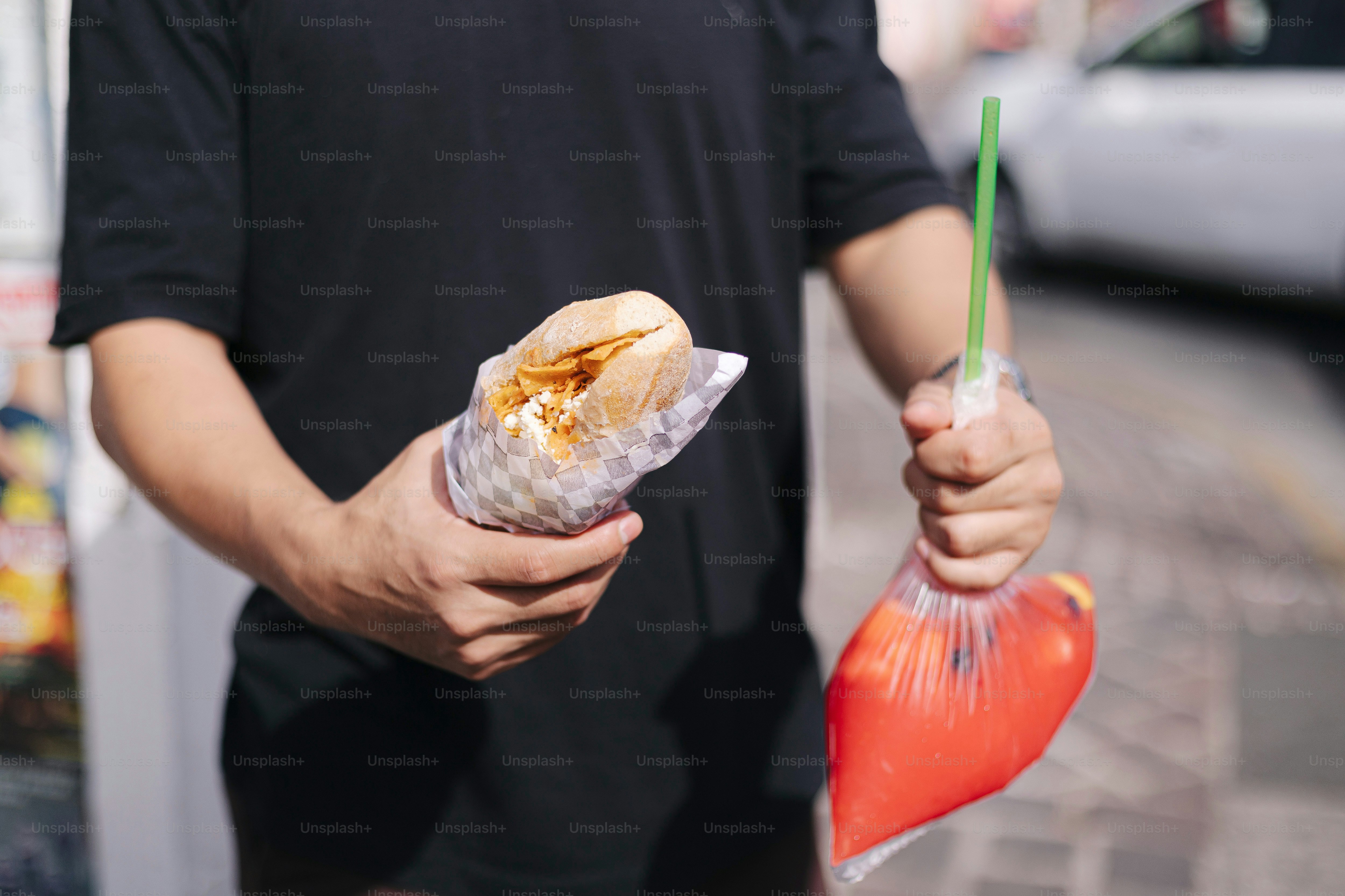 A man holding a hot dog in his hand