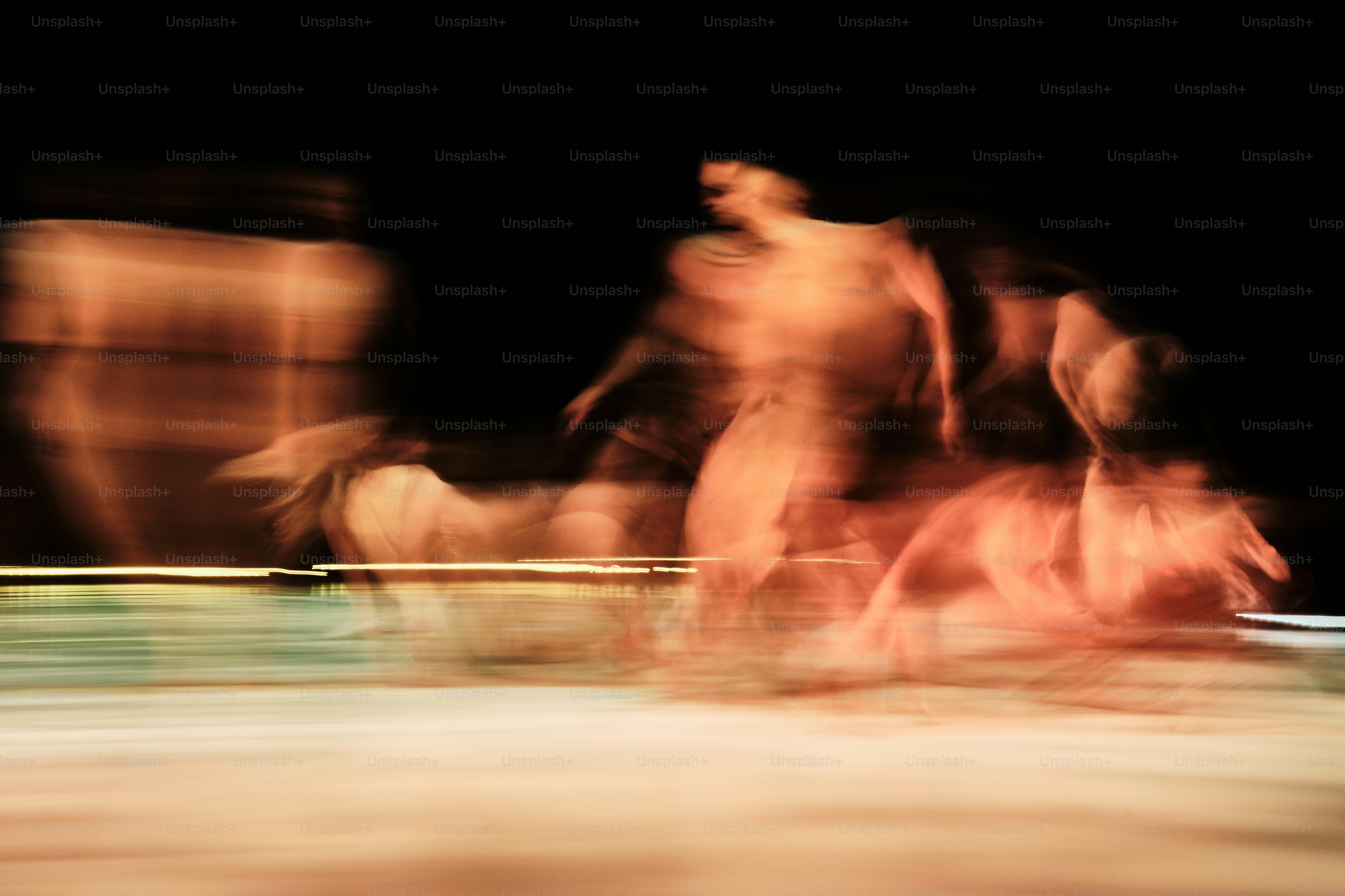 A blurry photo of a group of people riding bikes