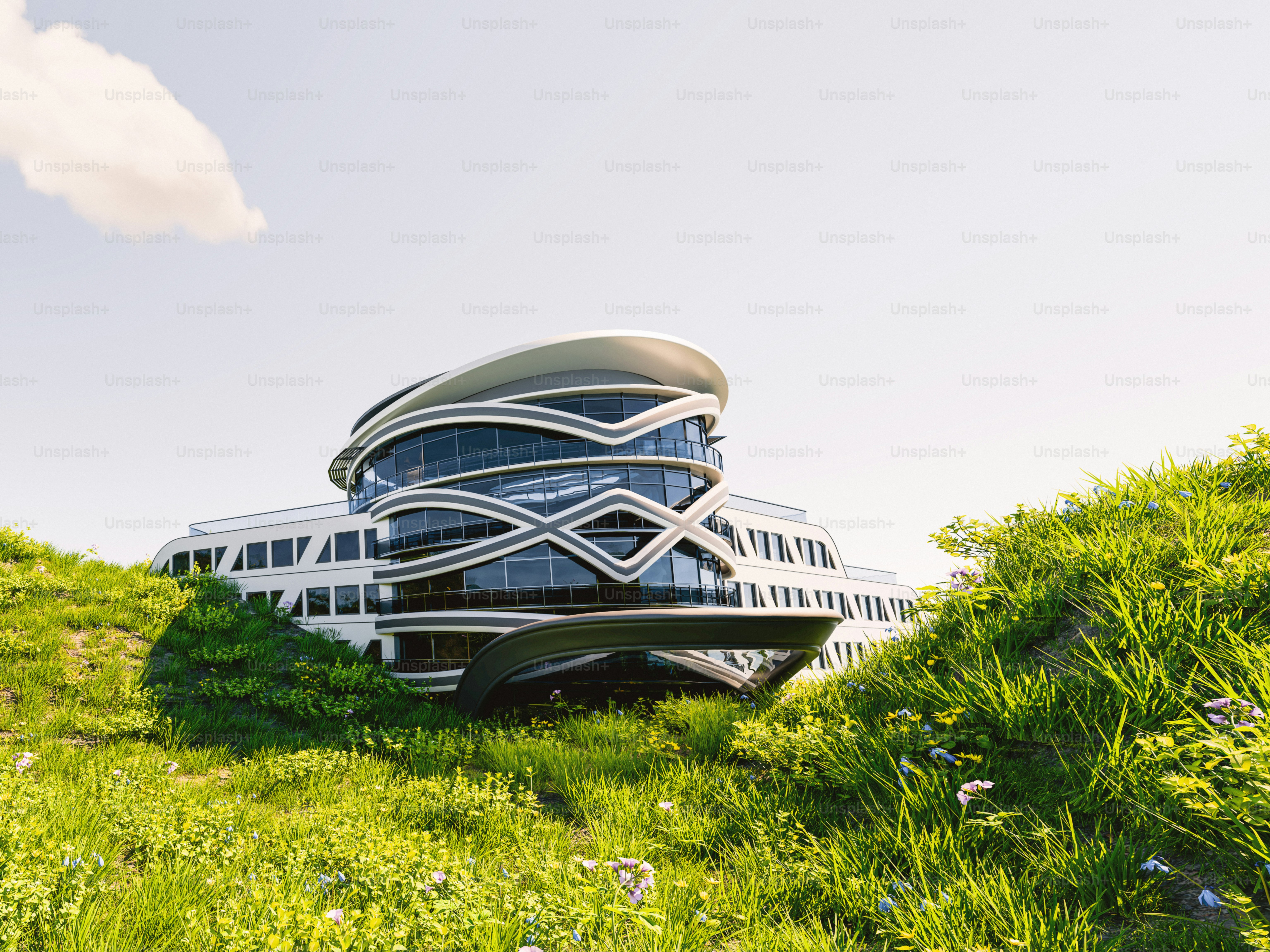 A building on top of a hill covered in grass