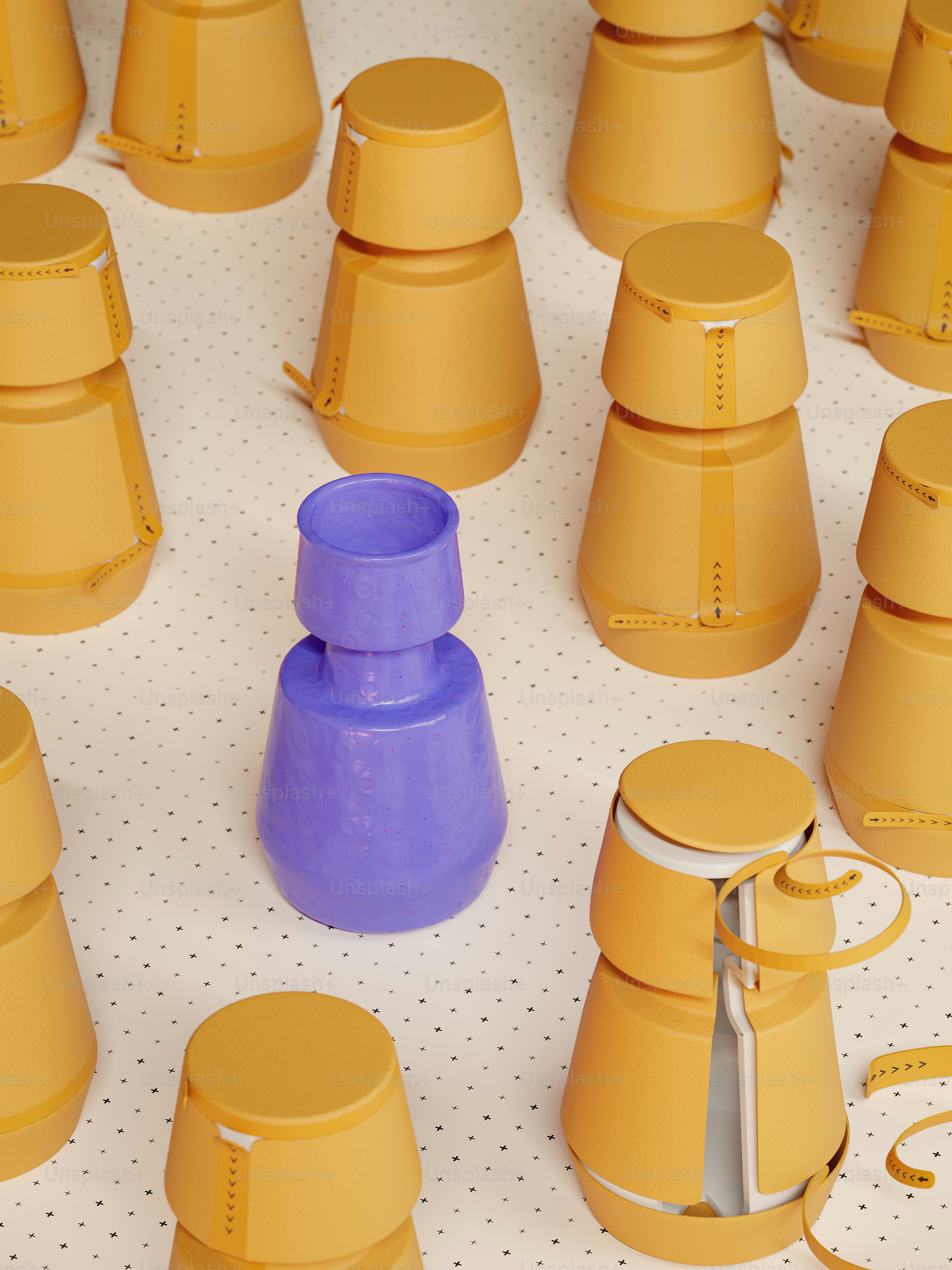 A table topped with yellow cups and a pair of scissors