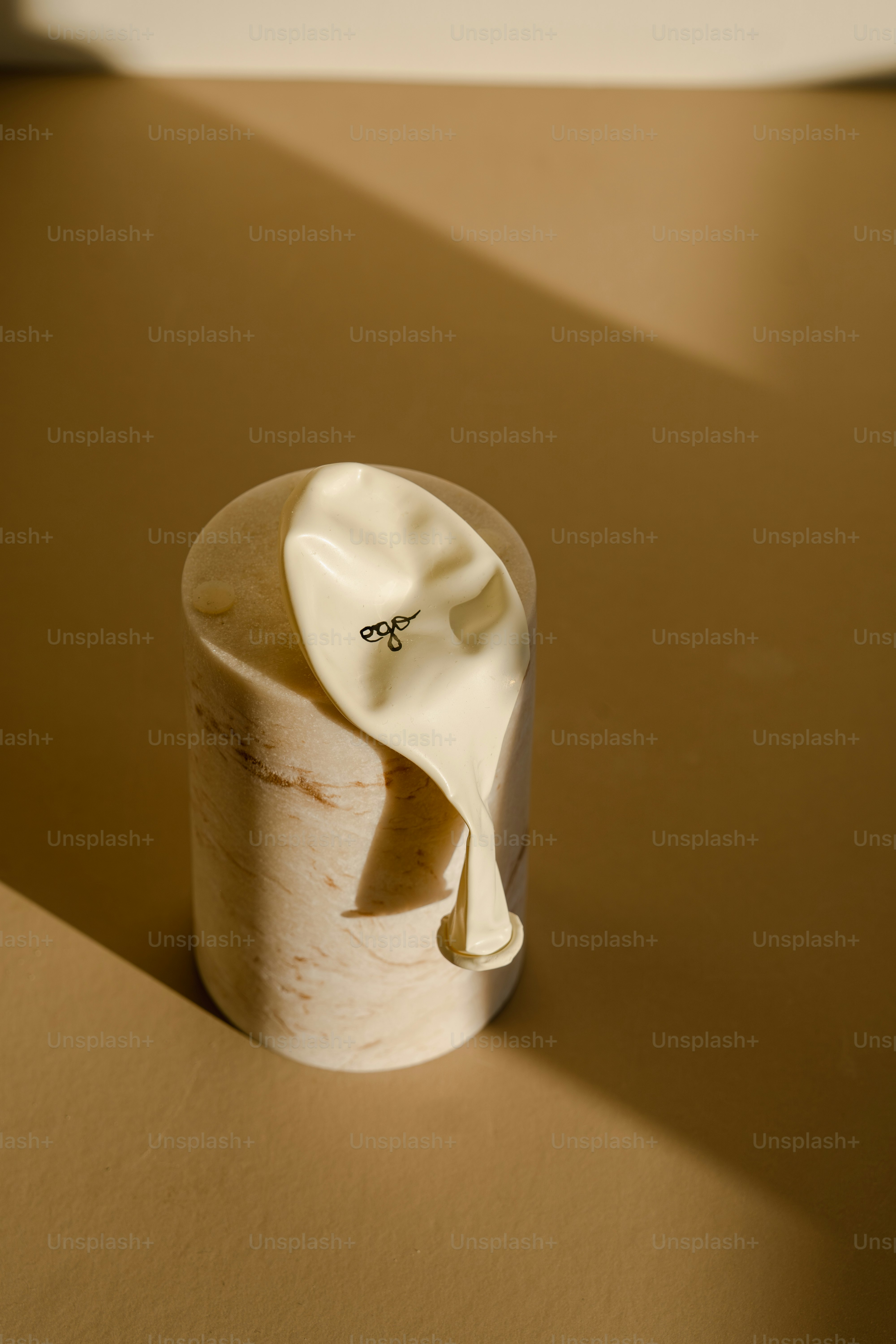 A white cup sitting on top of a table