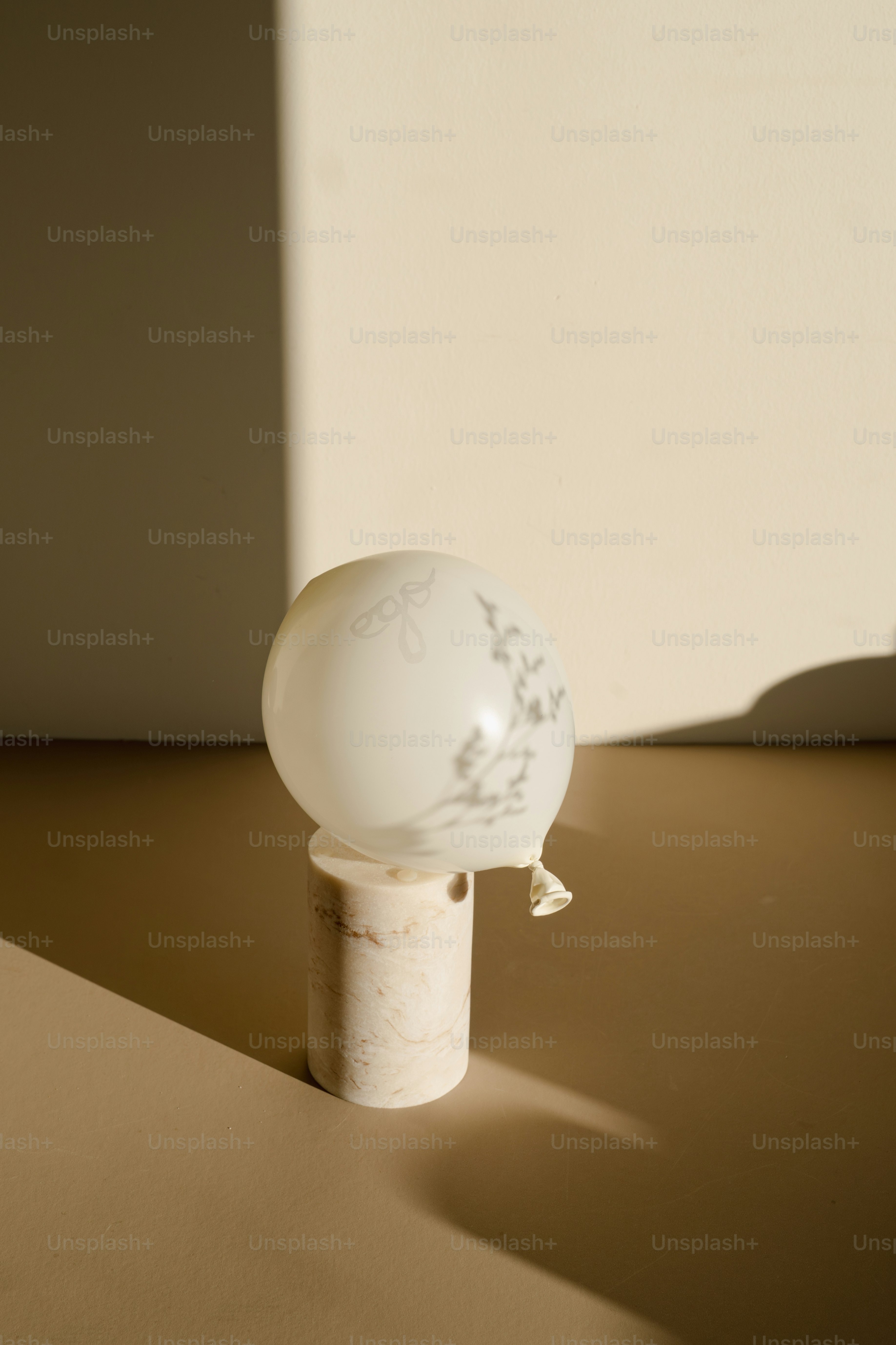 A white ball sitting on top of a wooden table