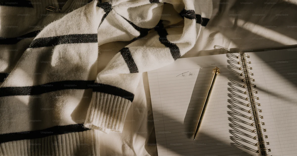 An open notebook and a pen on a bed photo – Notebook Image on Unsplash