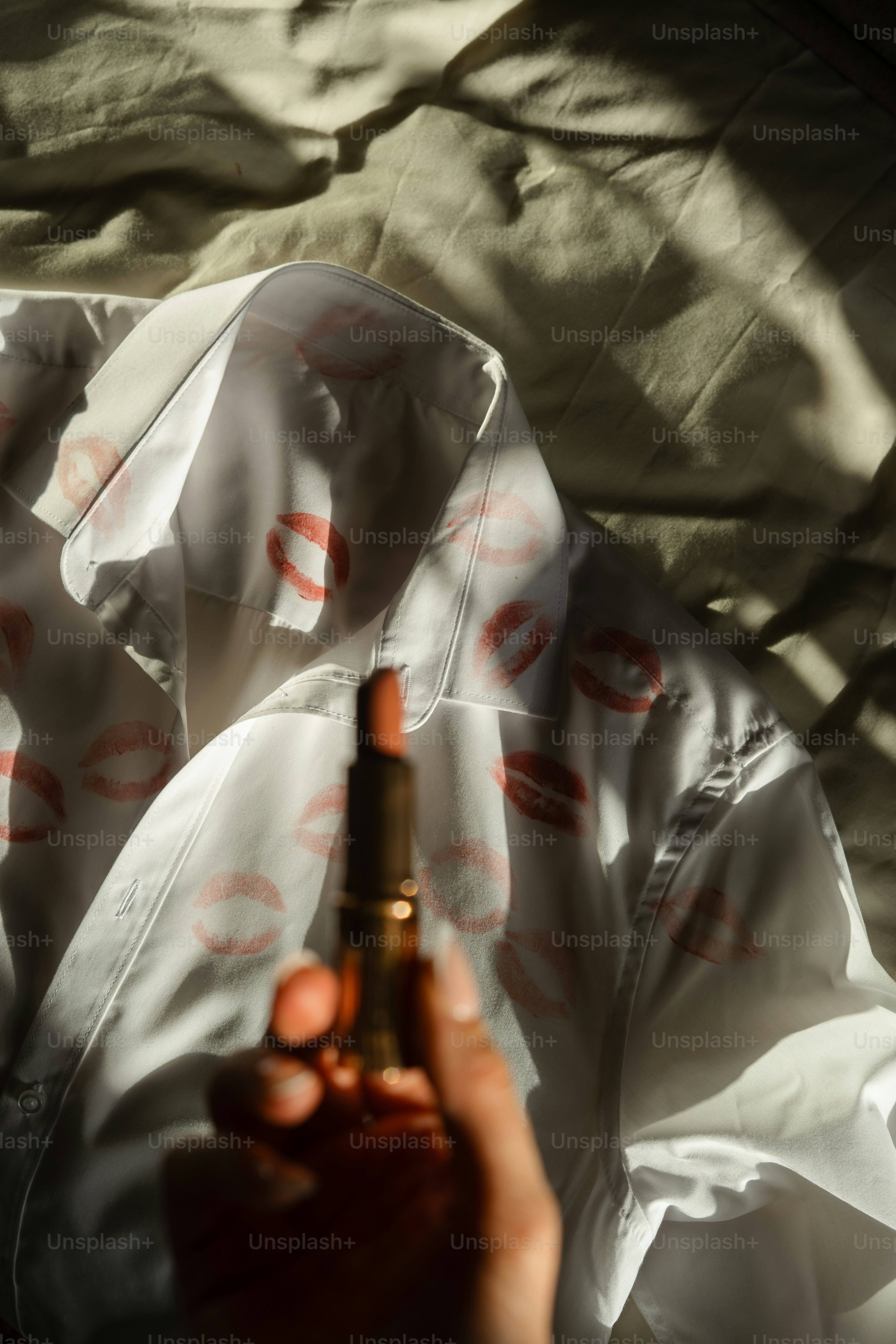 A person holding a cigarette in their hand