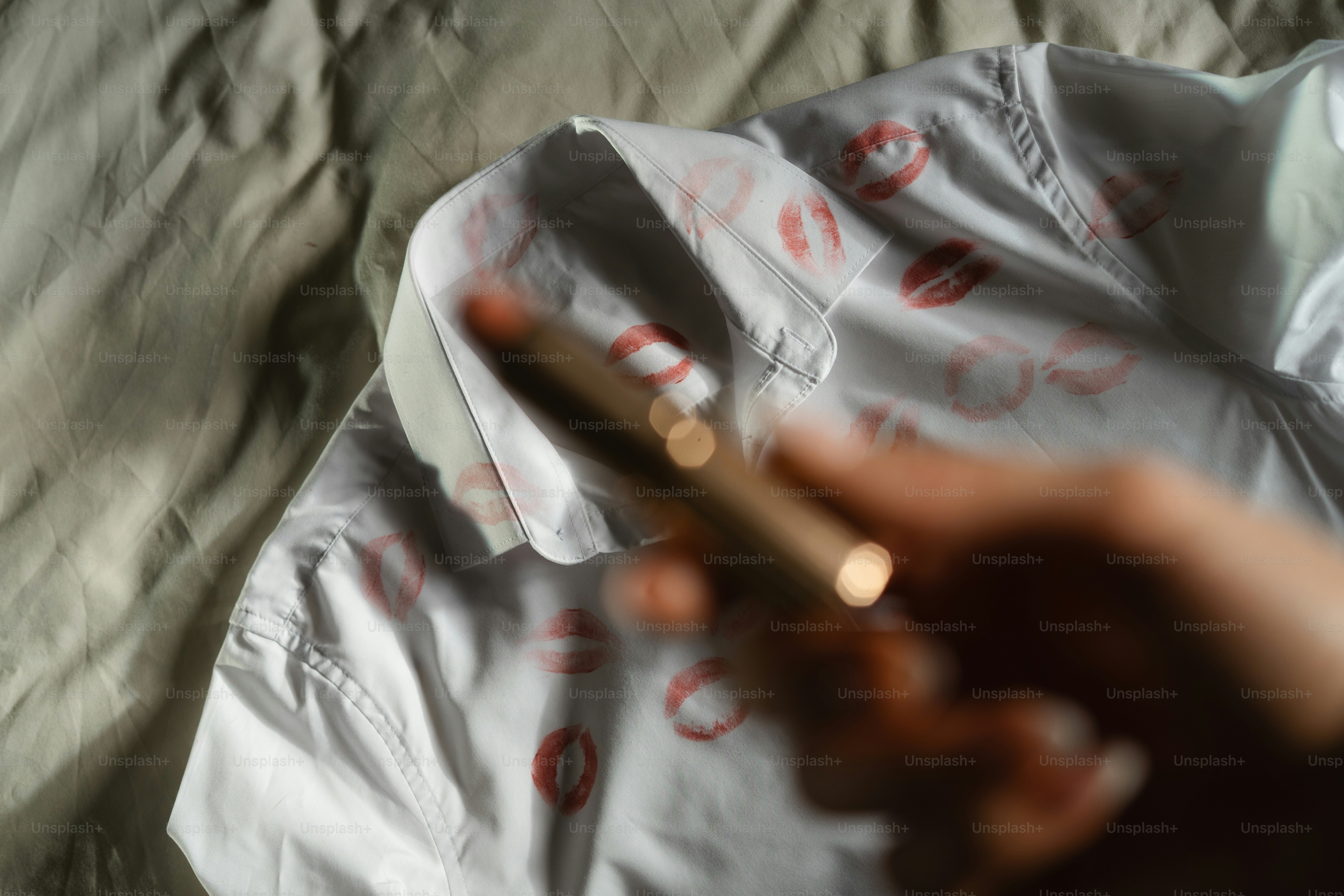 A person holding a cigarette in their hand