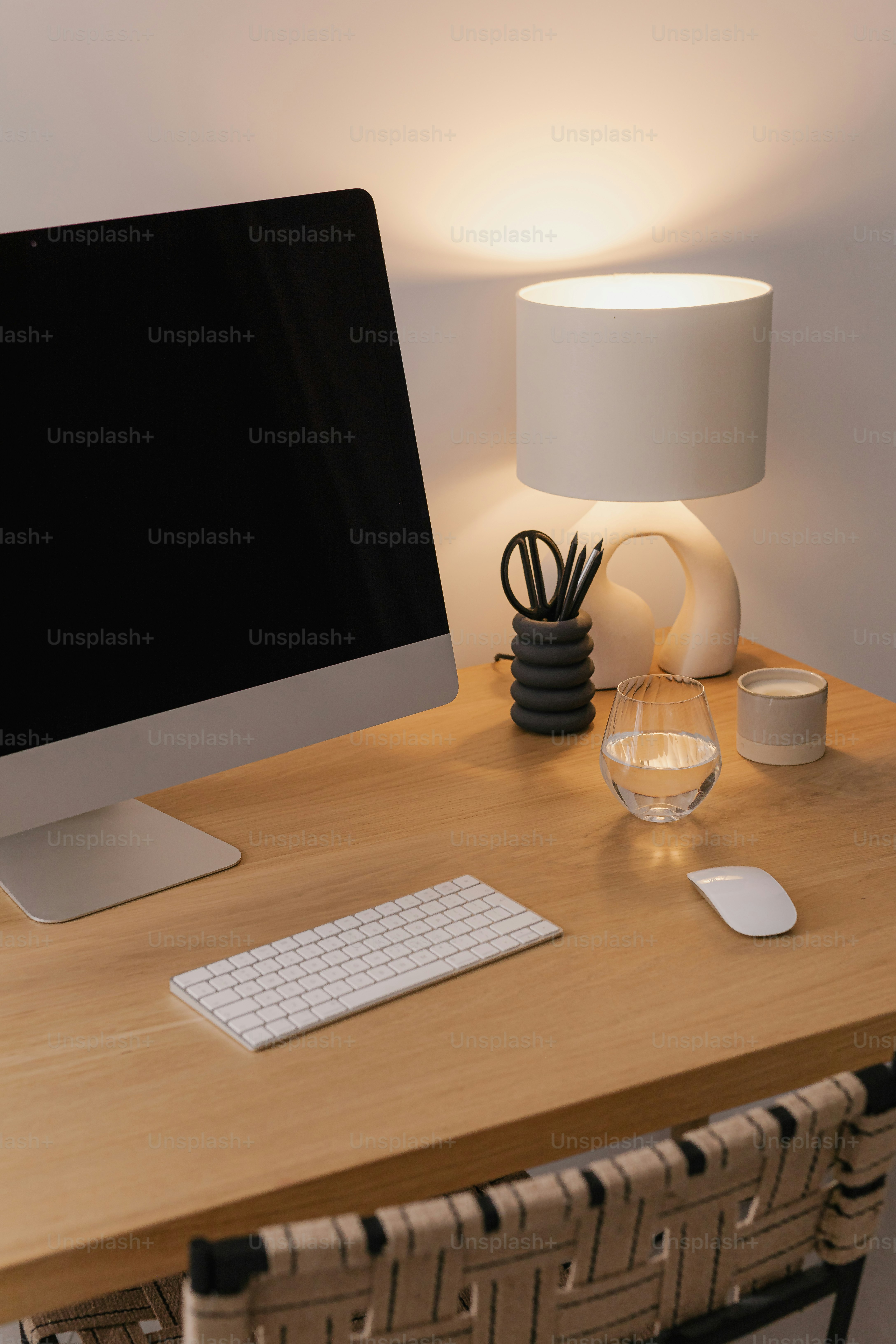 A computer monitor sitting on top of a wooden desk